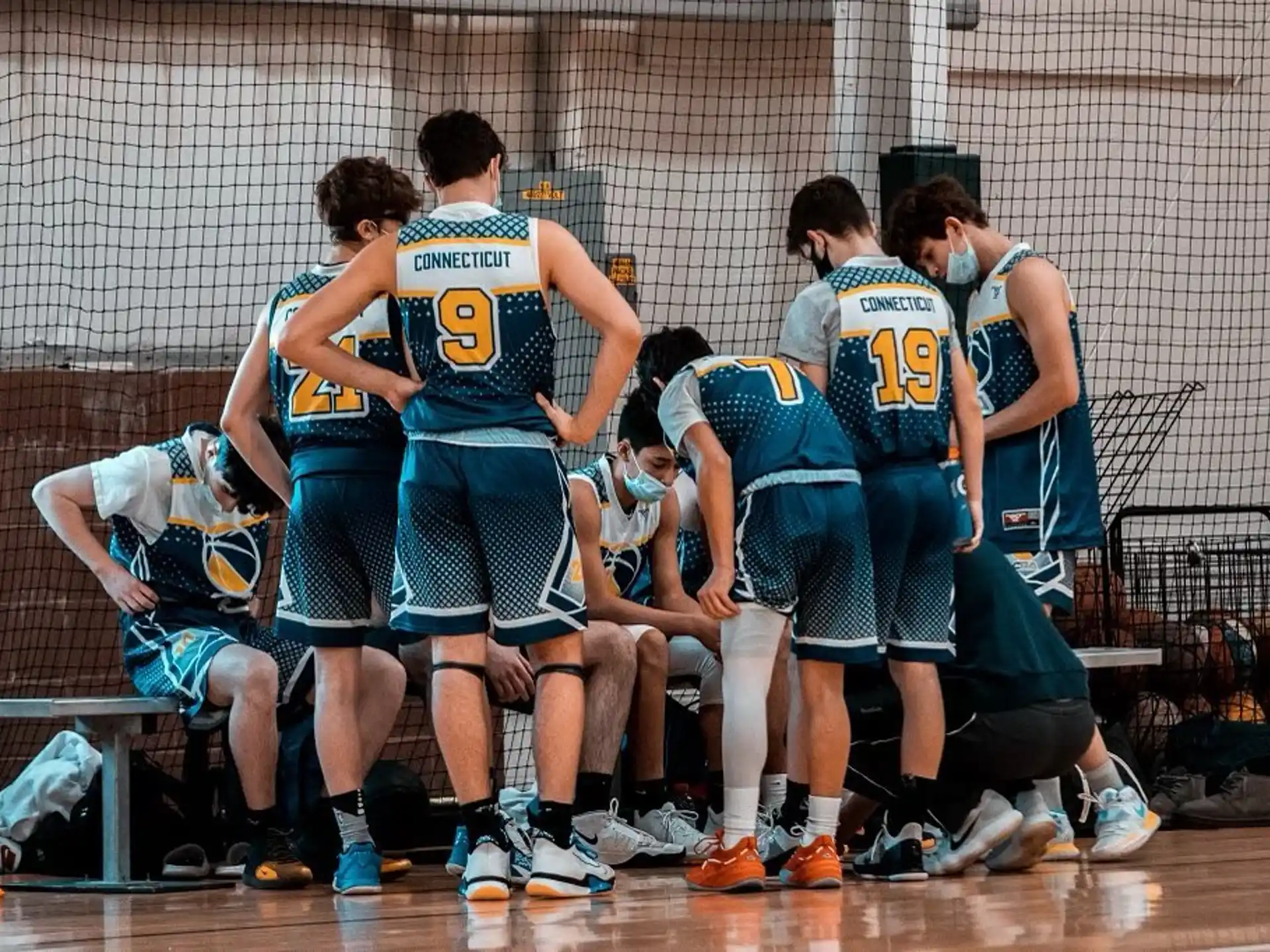 a group of people in sports uniforms