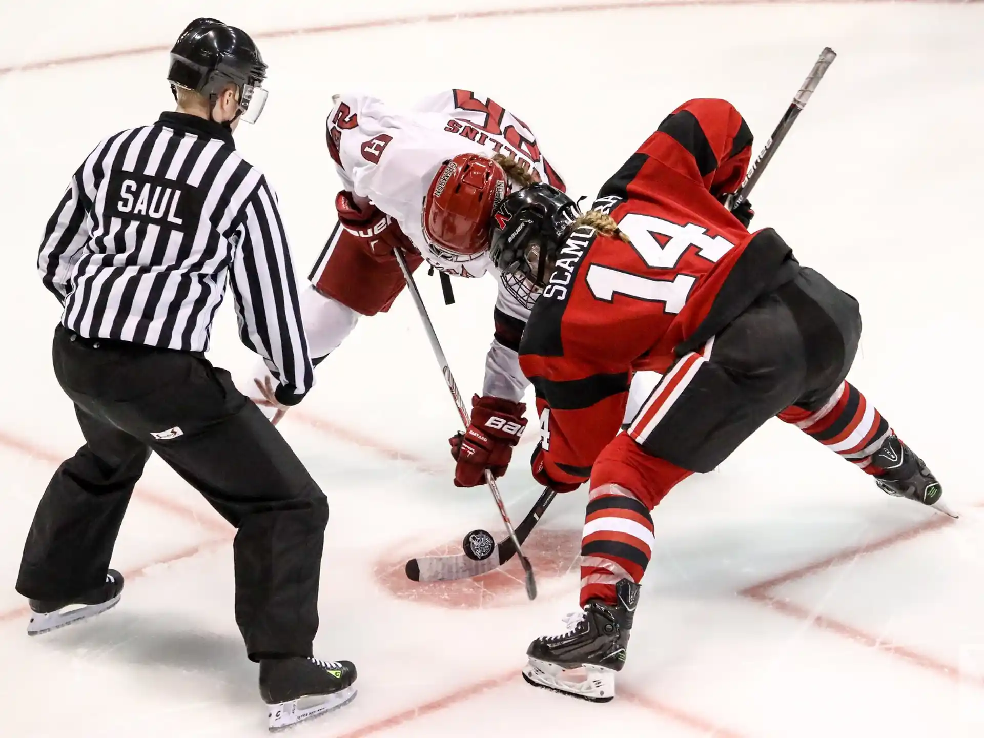 a hockey player falling on the ice