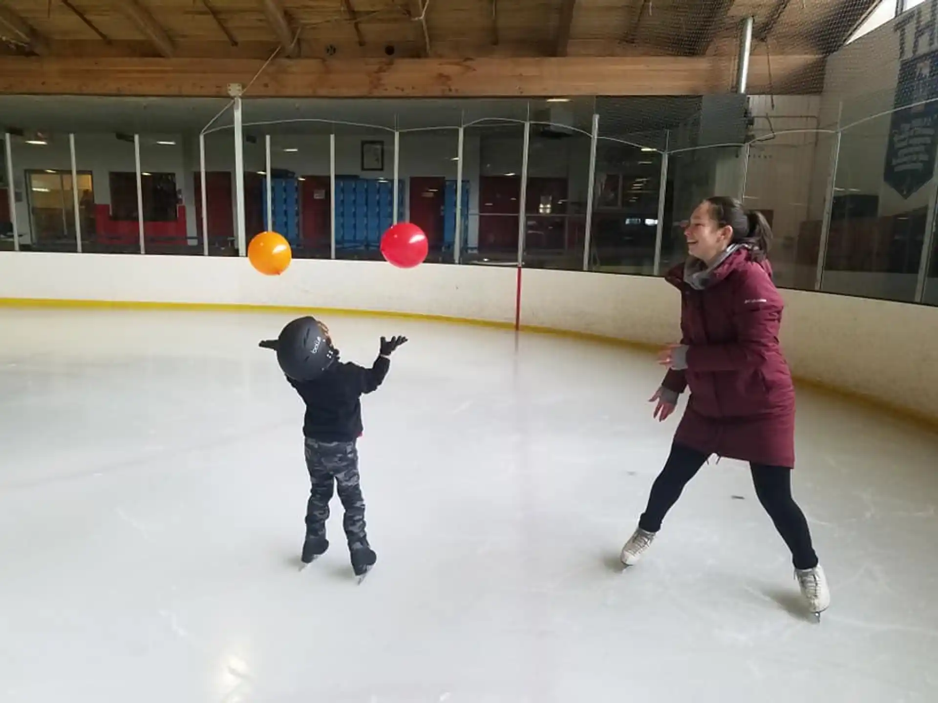 a person and a child ice skating