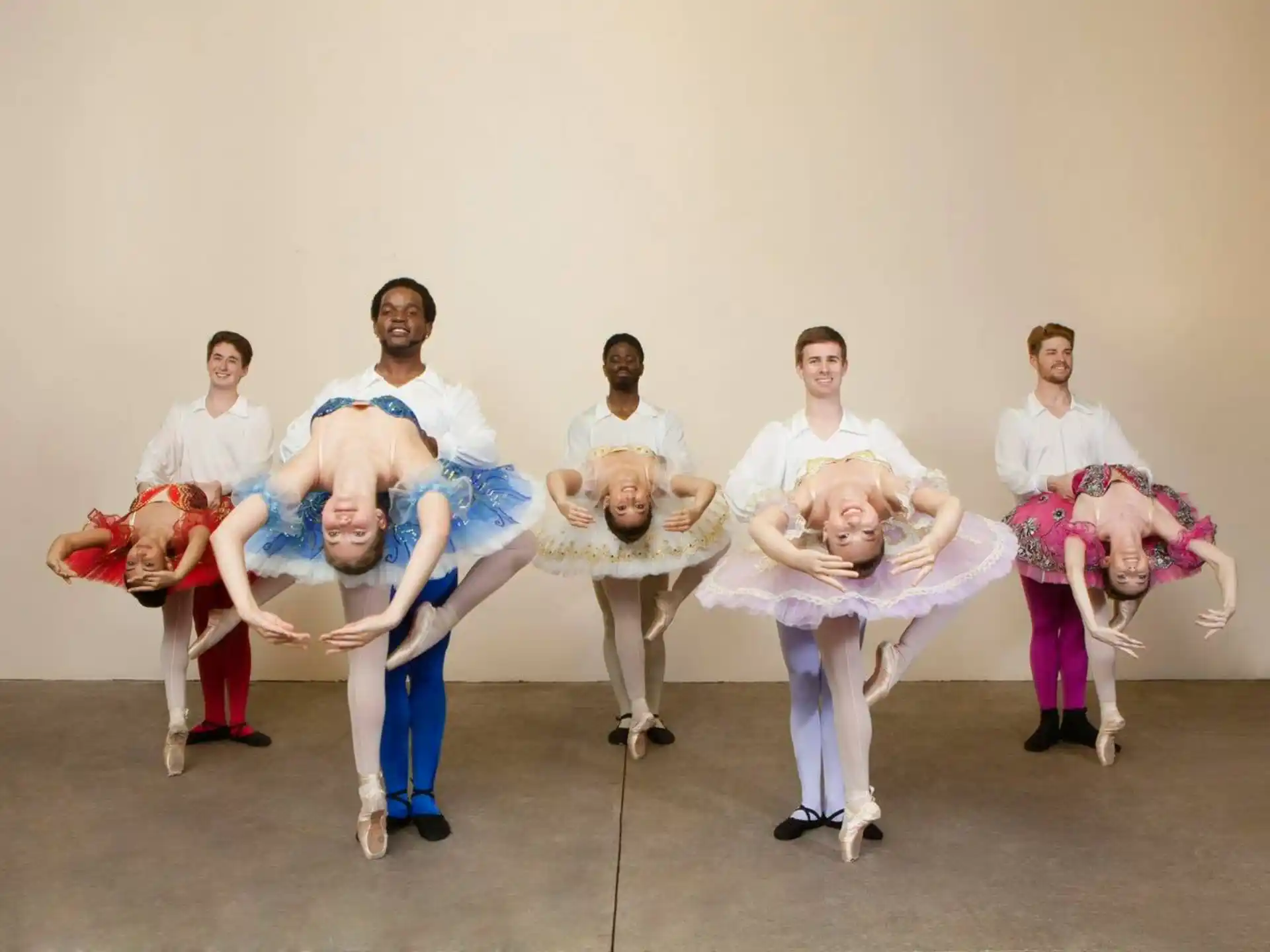 a group of people in white outfits