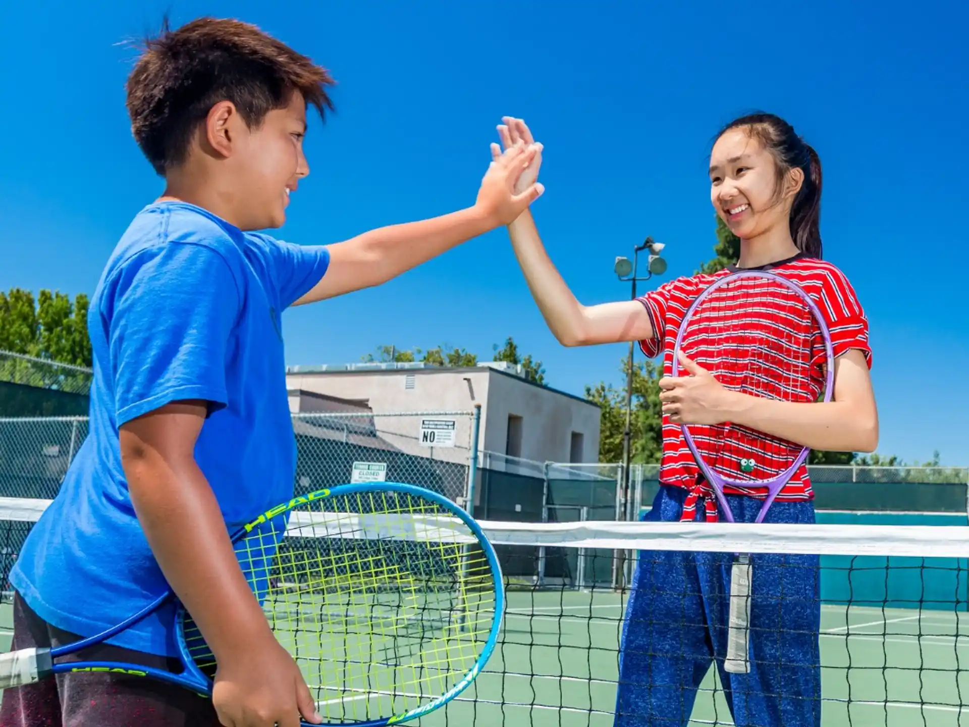 a man and a woman playing tennis
