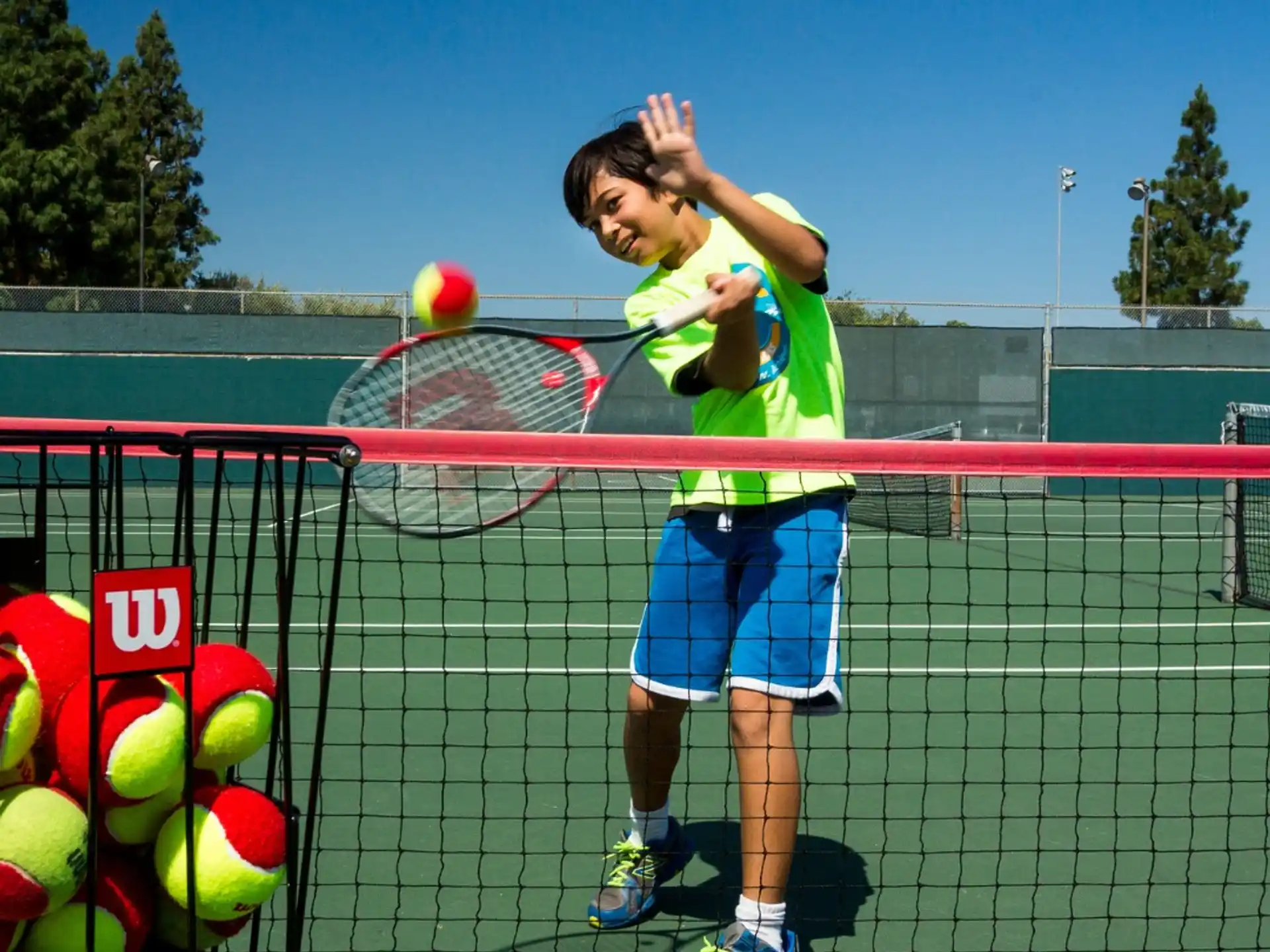 a person hitting a ball with a tennis racket