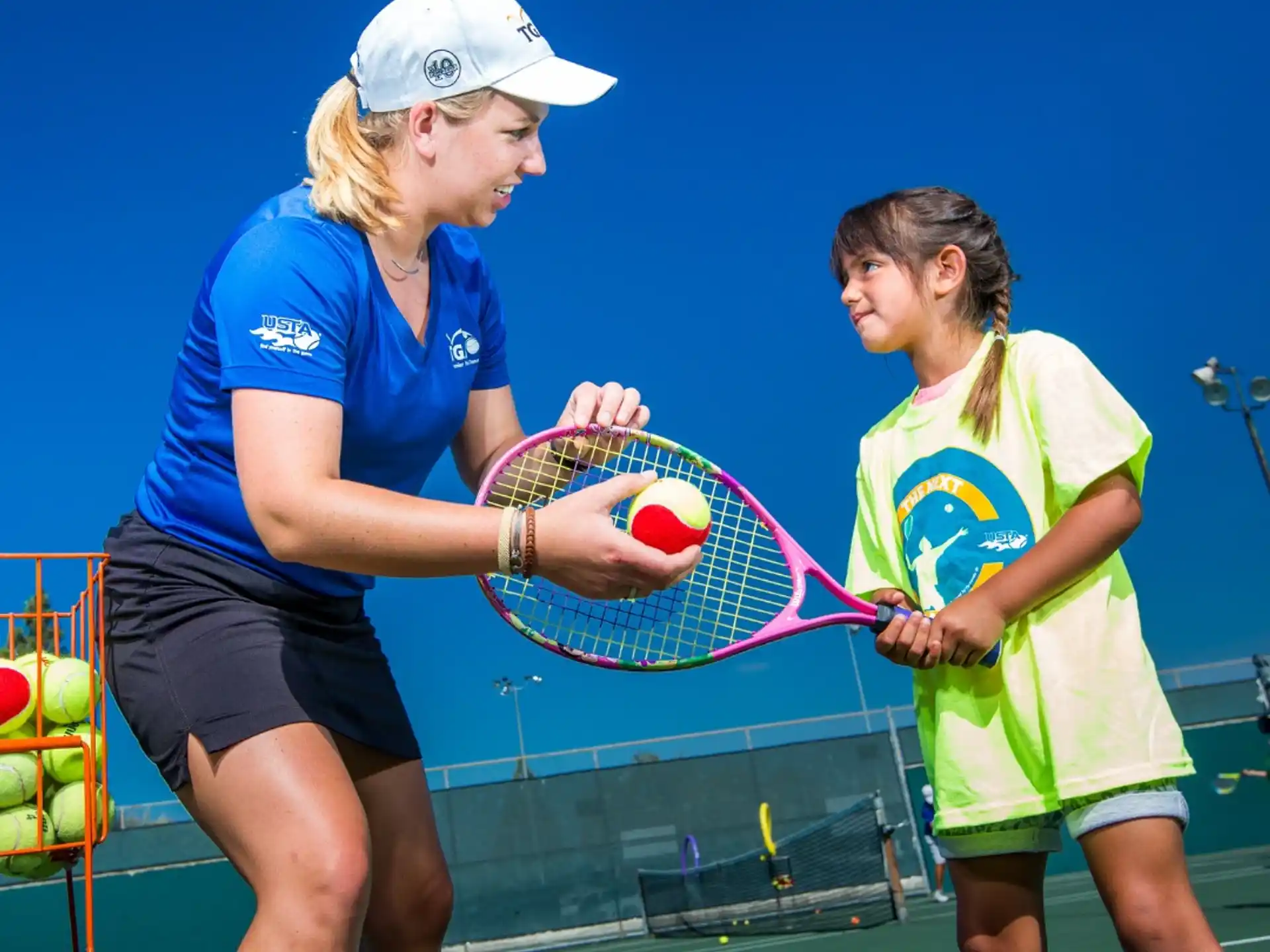 women playing tennis on a court
