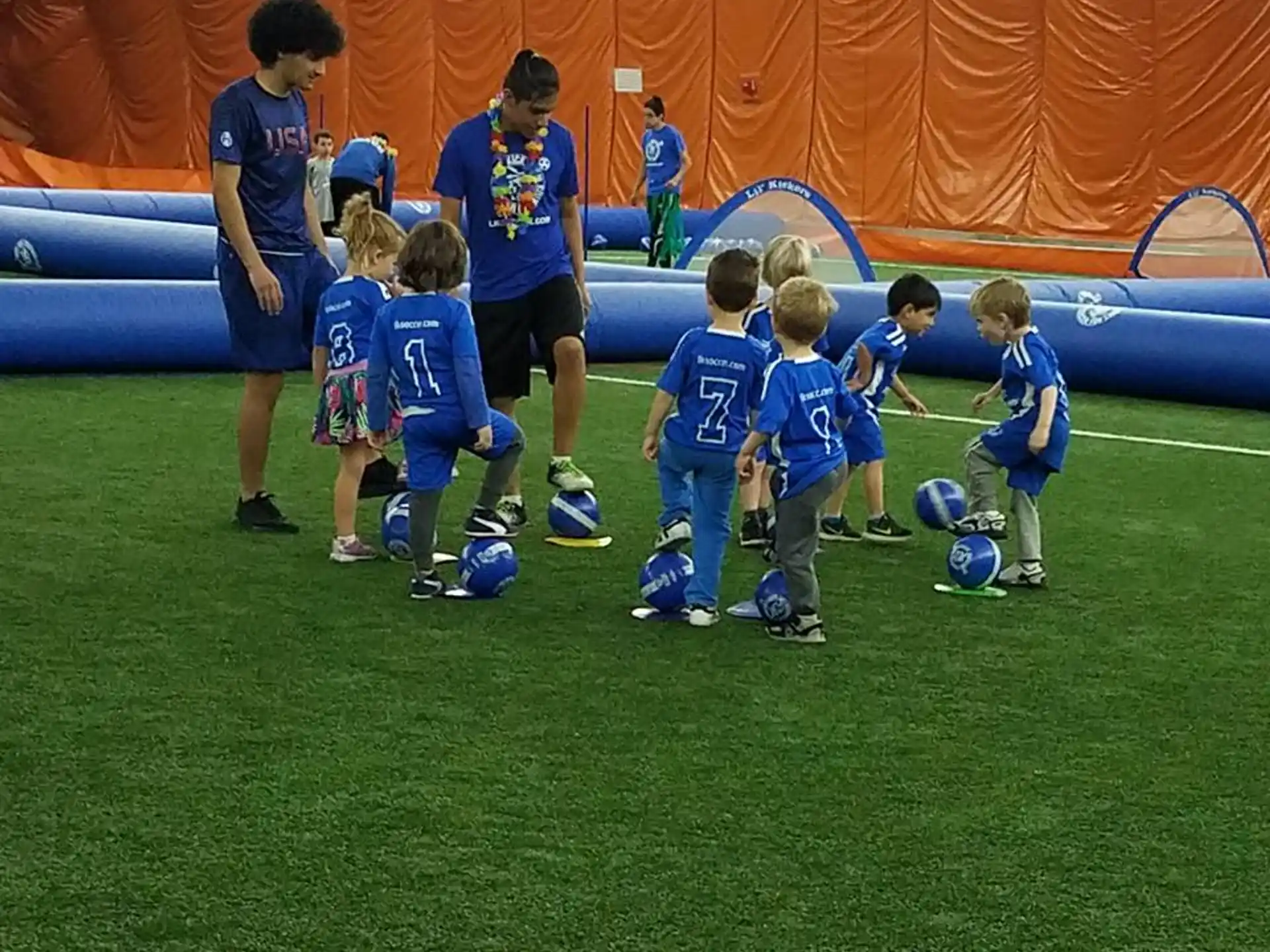a group of kids playing football