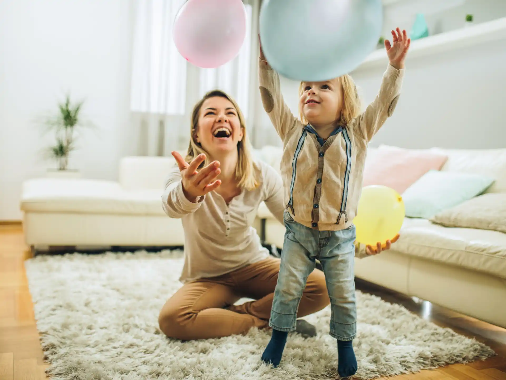 a couple of girls holding balloons