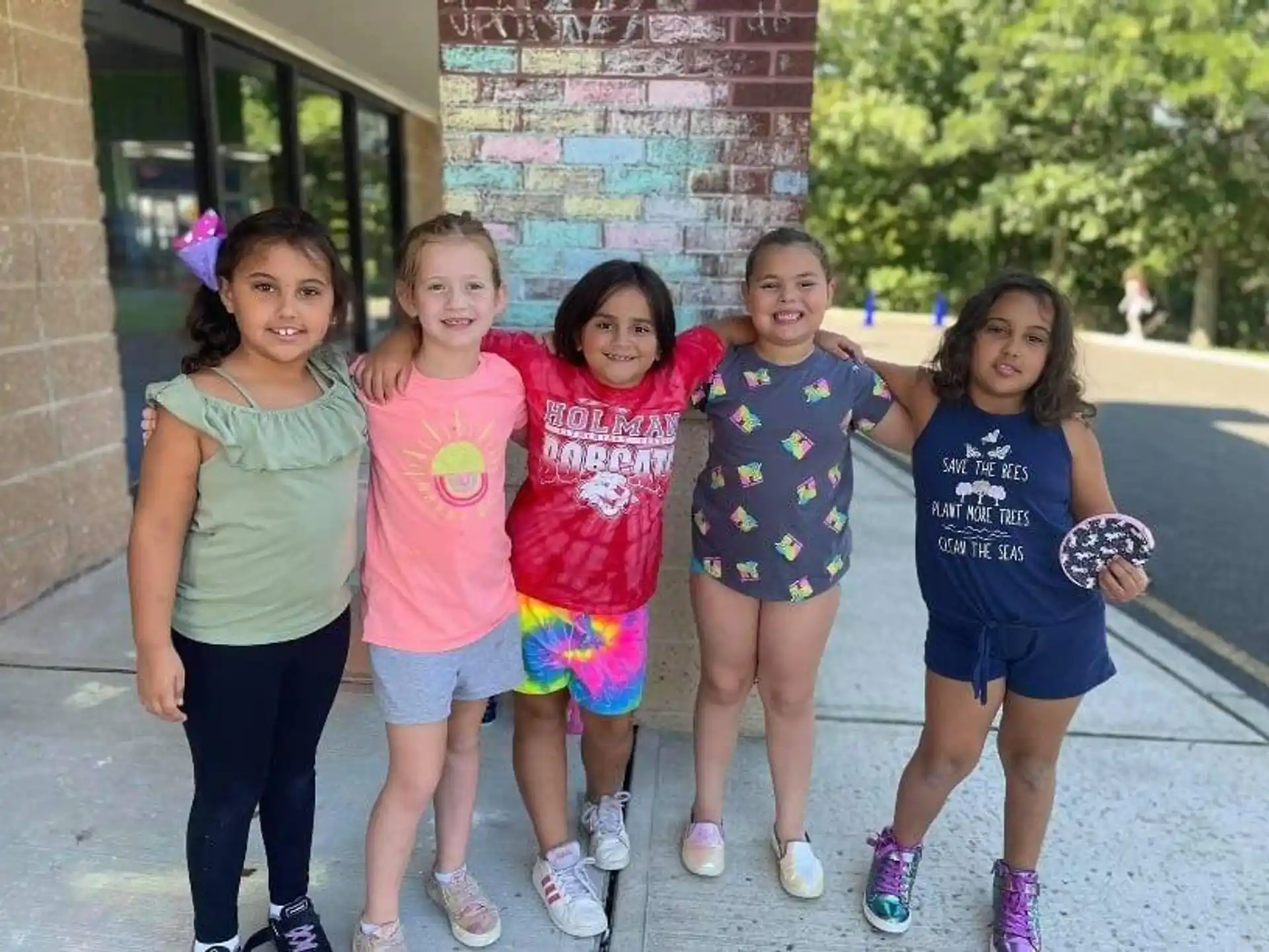 a group of girls posing for a photo