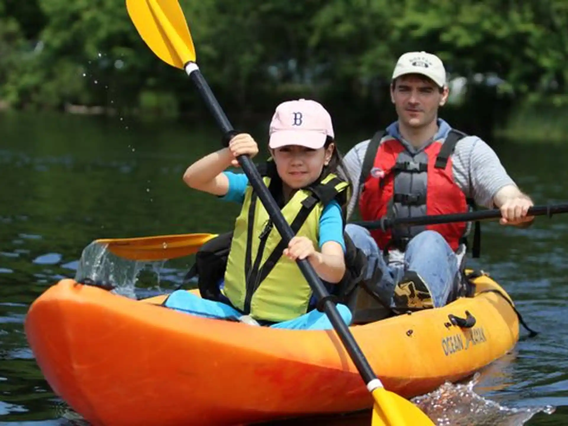 a person and a boy in a canoe