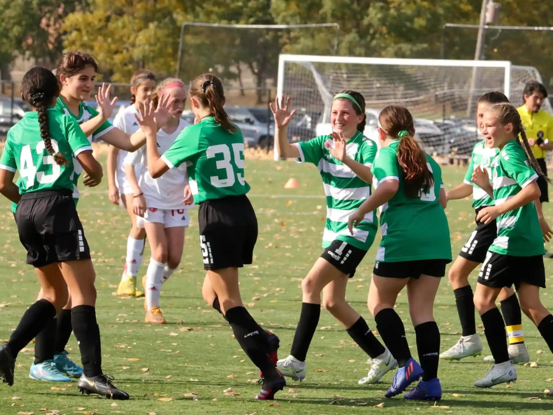 a group of girls playing football