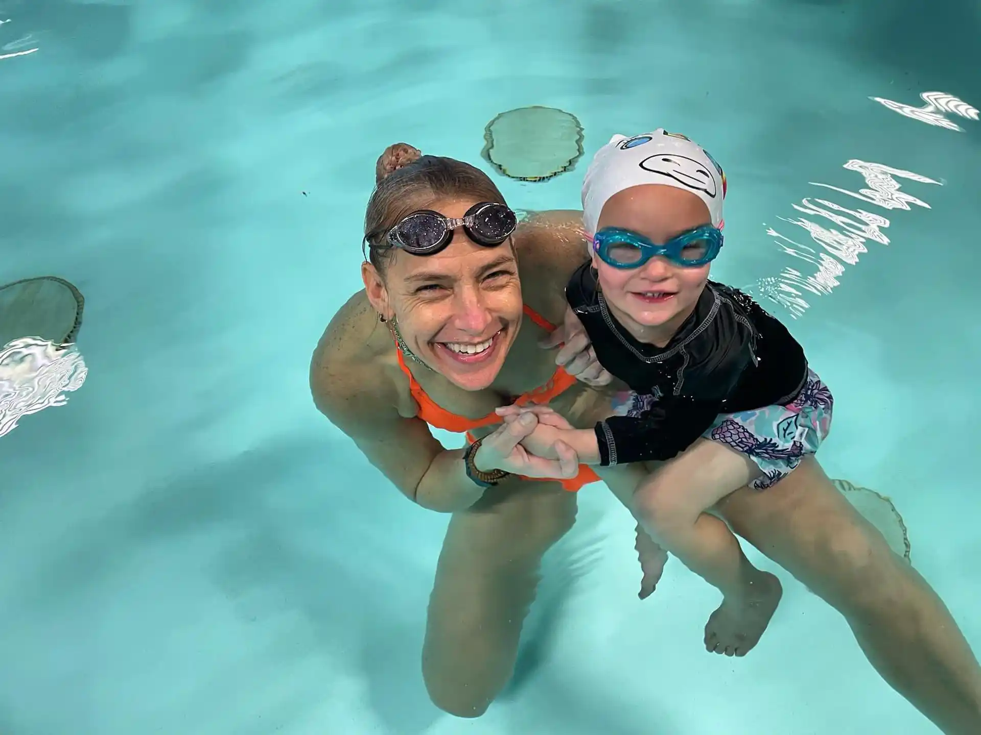 a person and a boy in the water