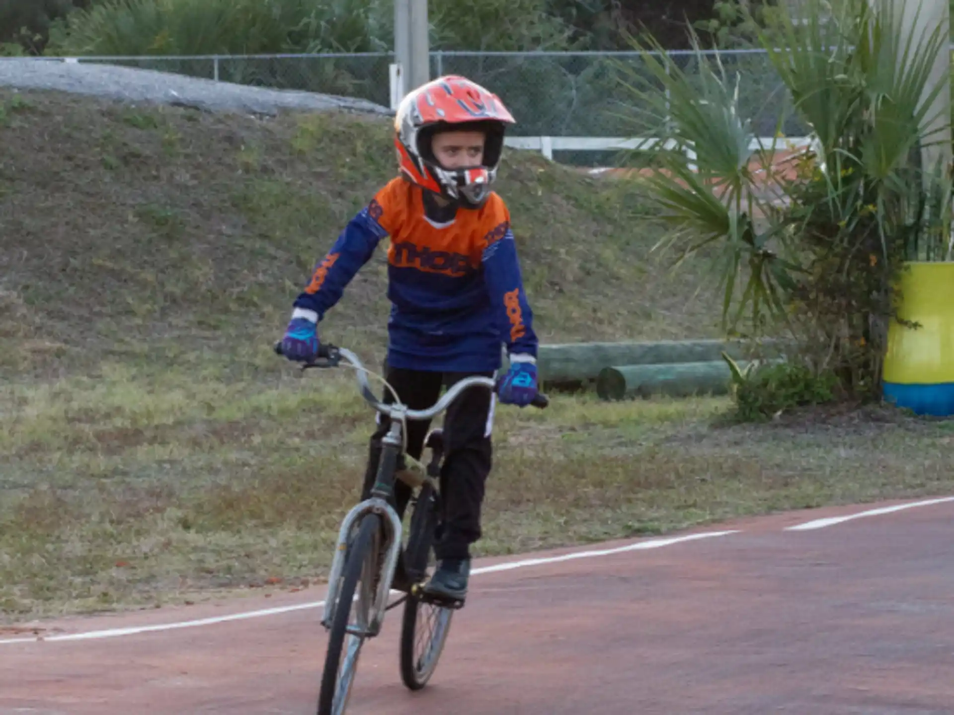 a boy riding a bicycle