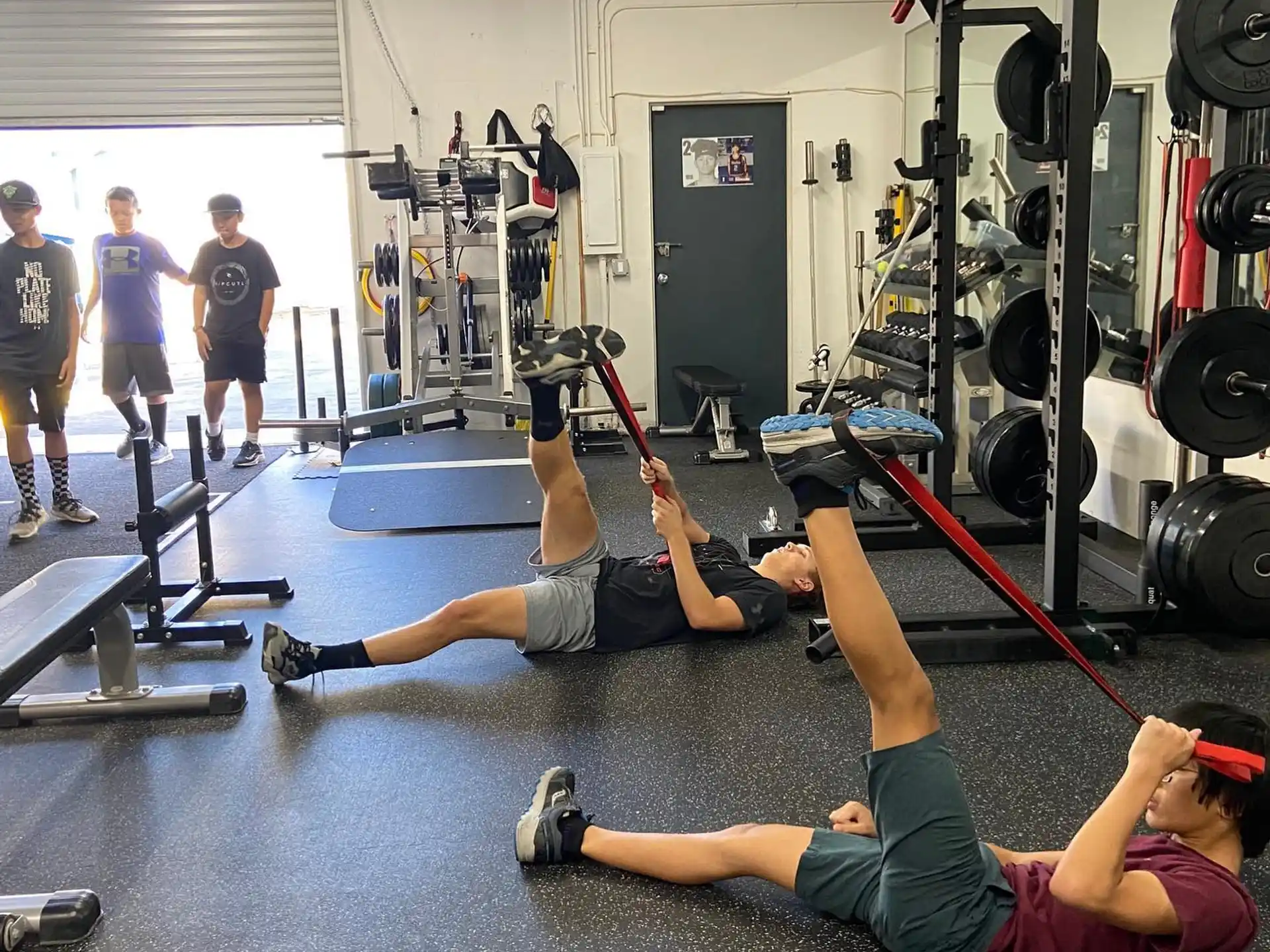 a group of people exercising in a gym