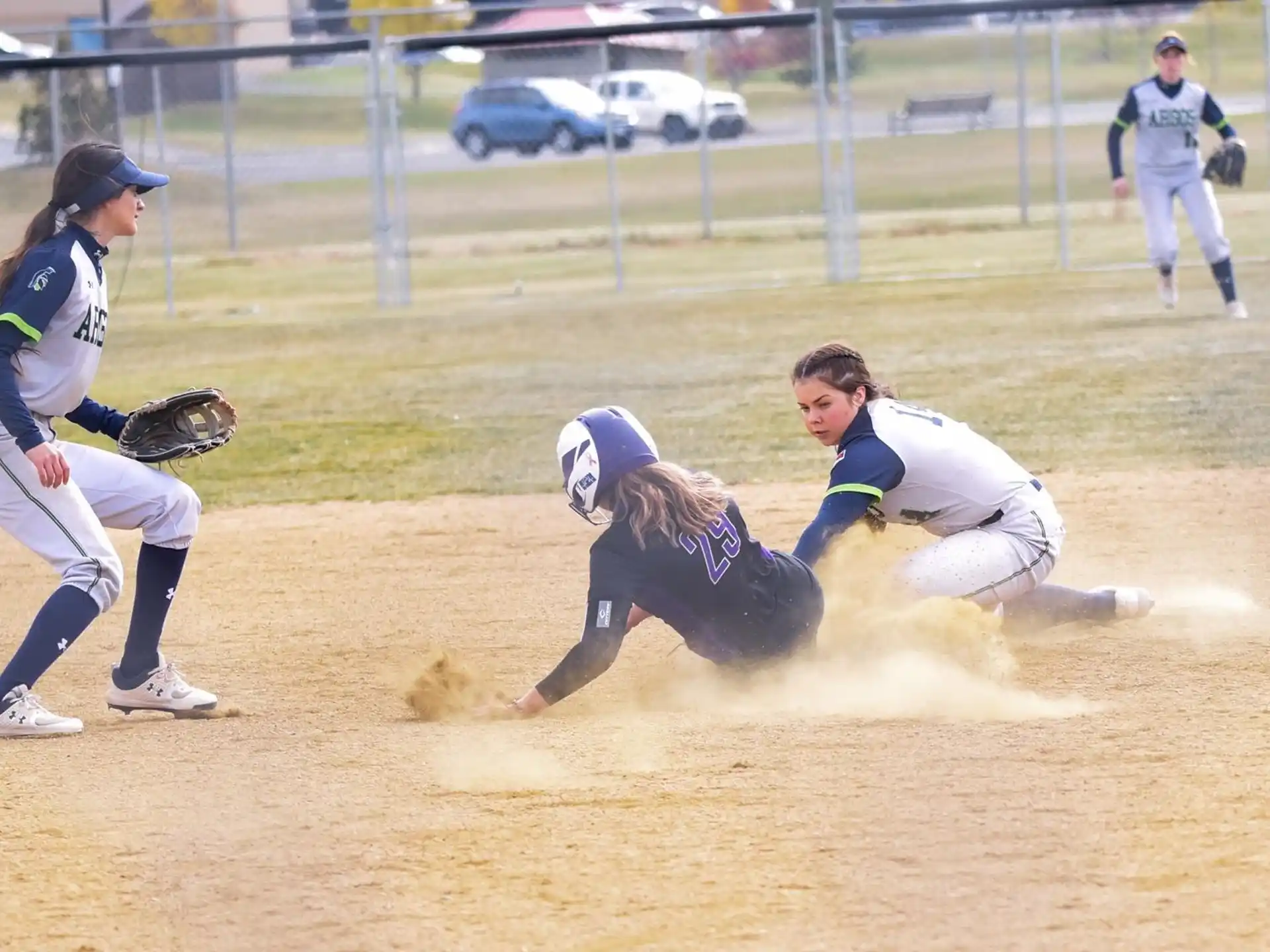 a person sliding into a base