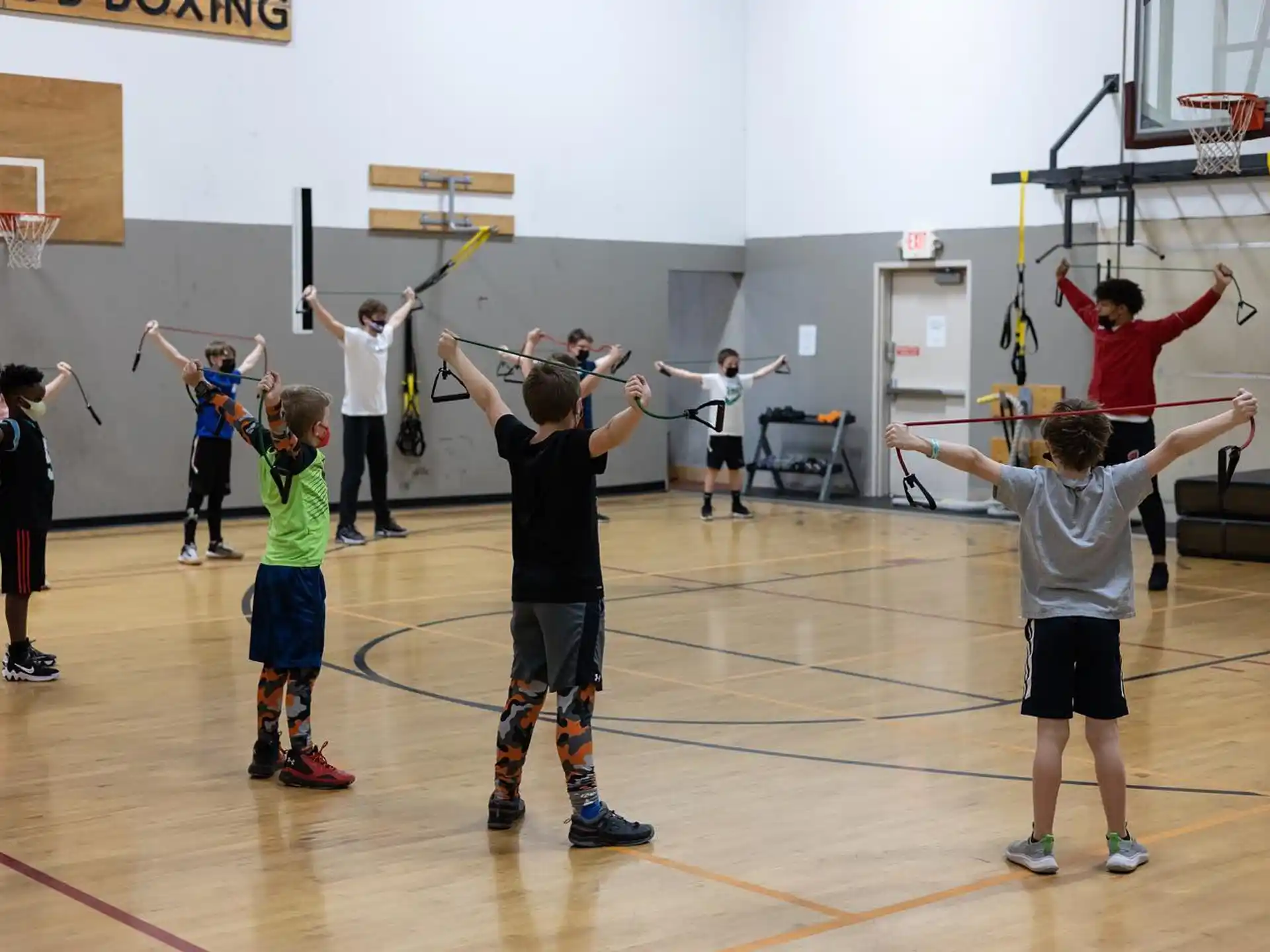 a group of people playing basketball