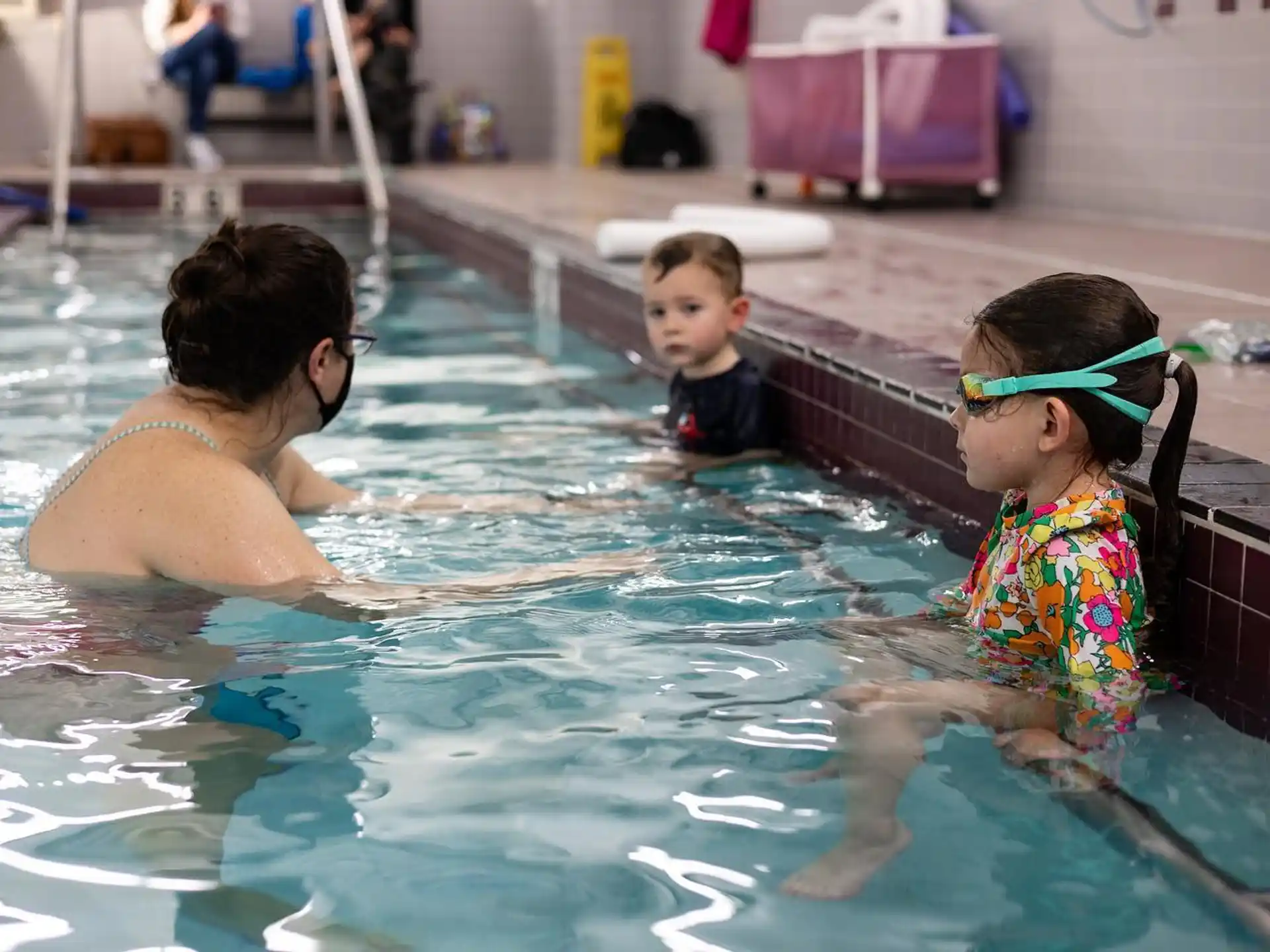 a person and a child in a pool