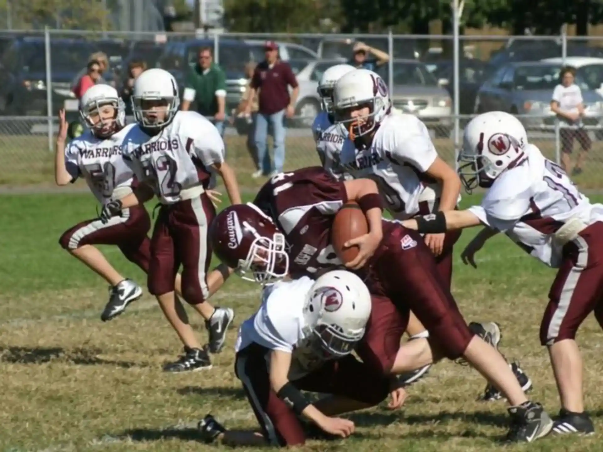 a group of people playing football