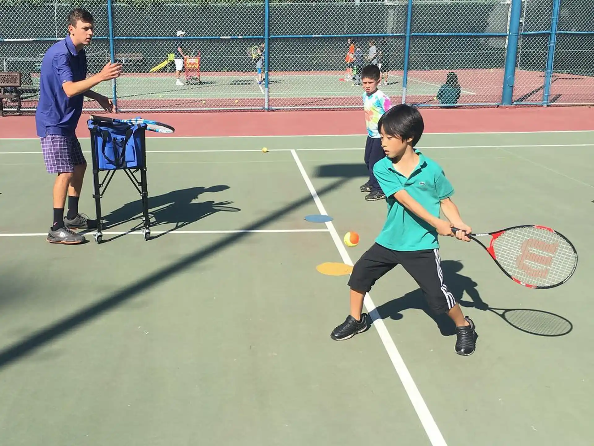 a boy playing tennis