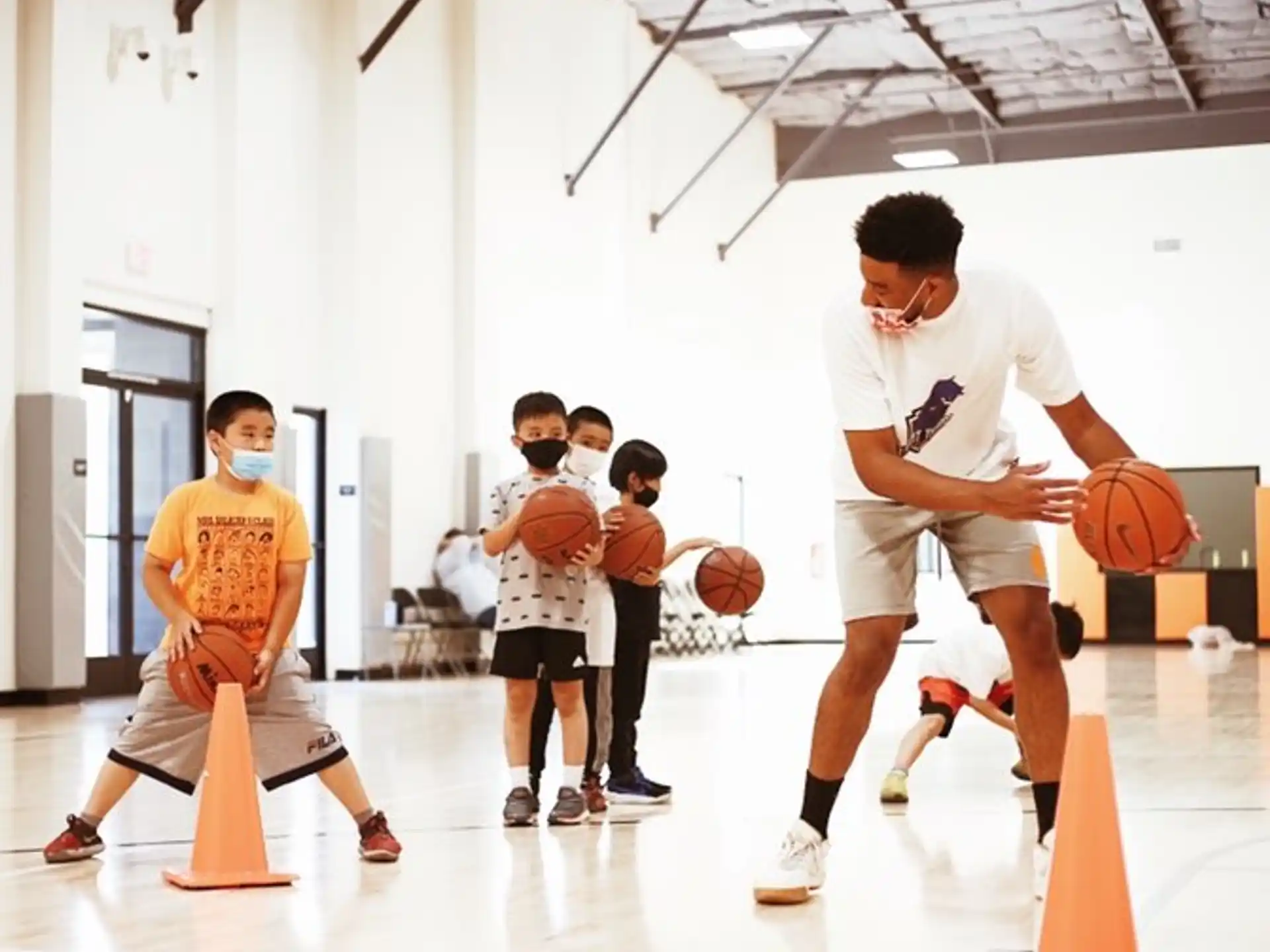 a group of people playing basketball