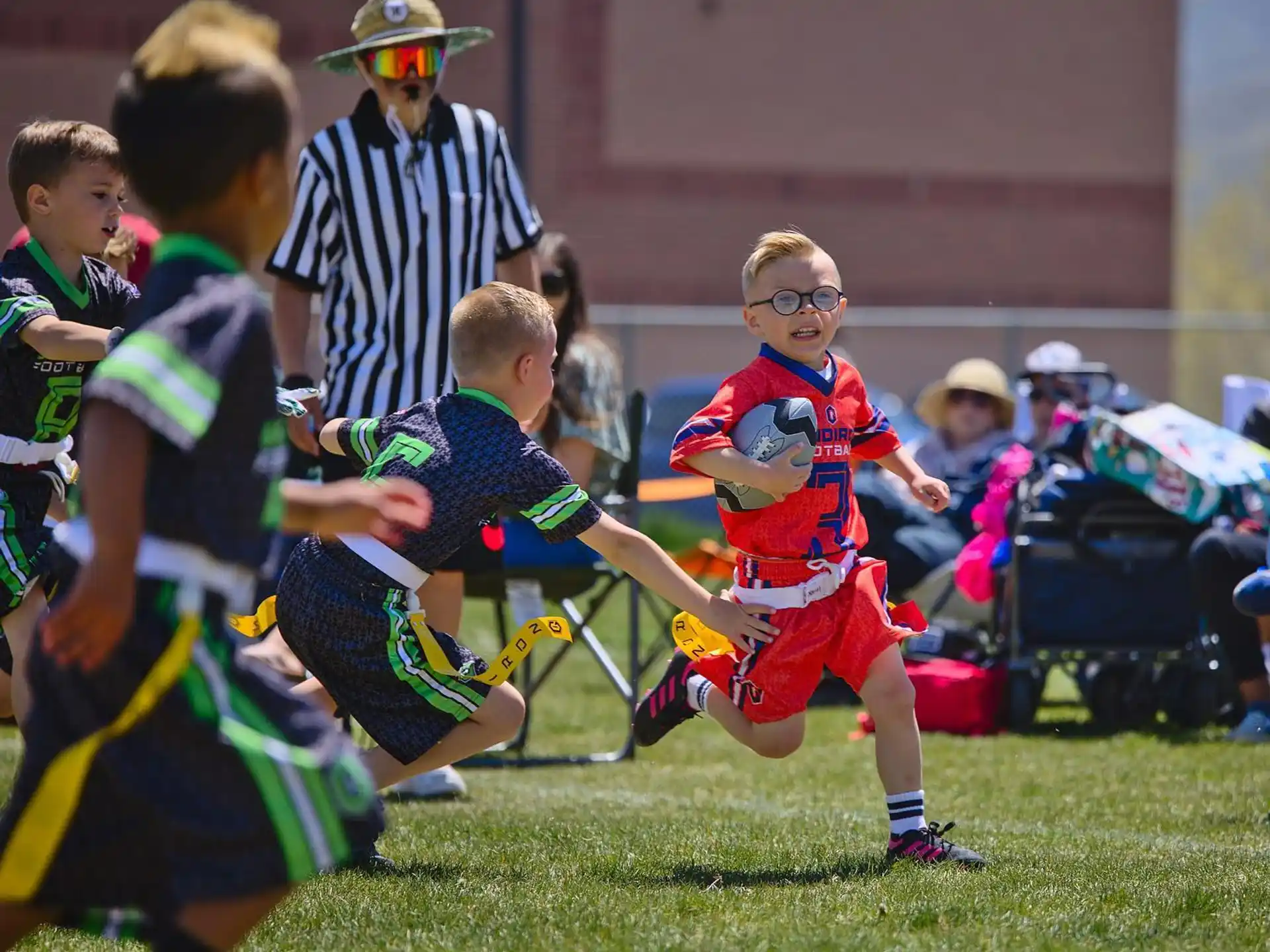 a group of kids playing football