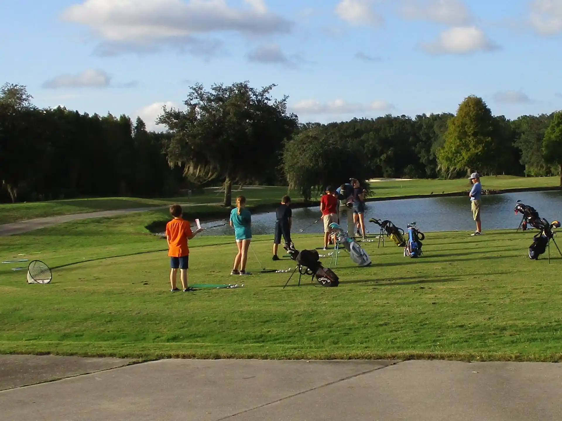 a group of people on a golf course