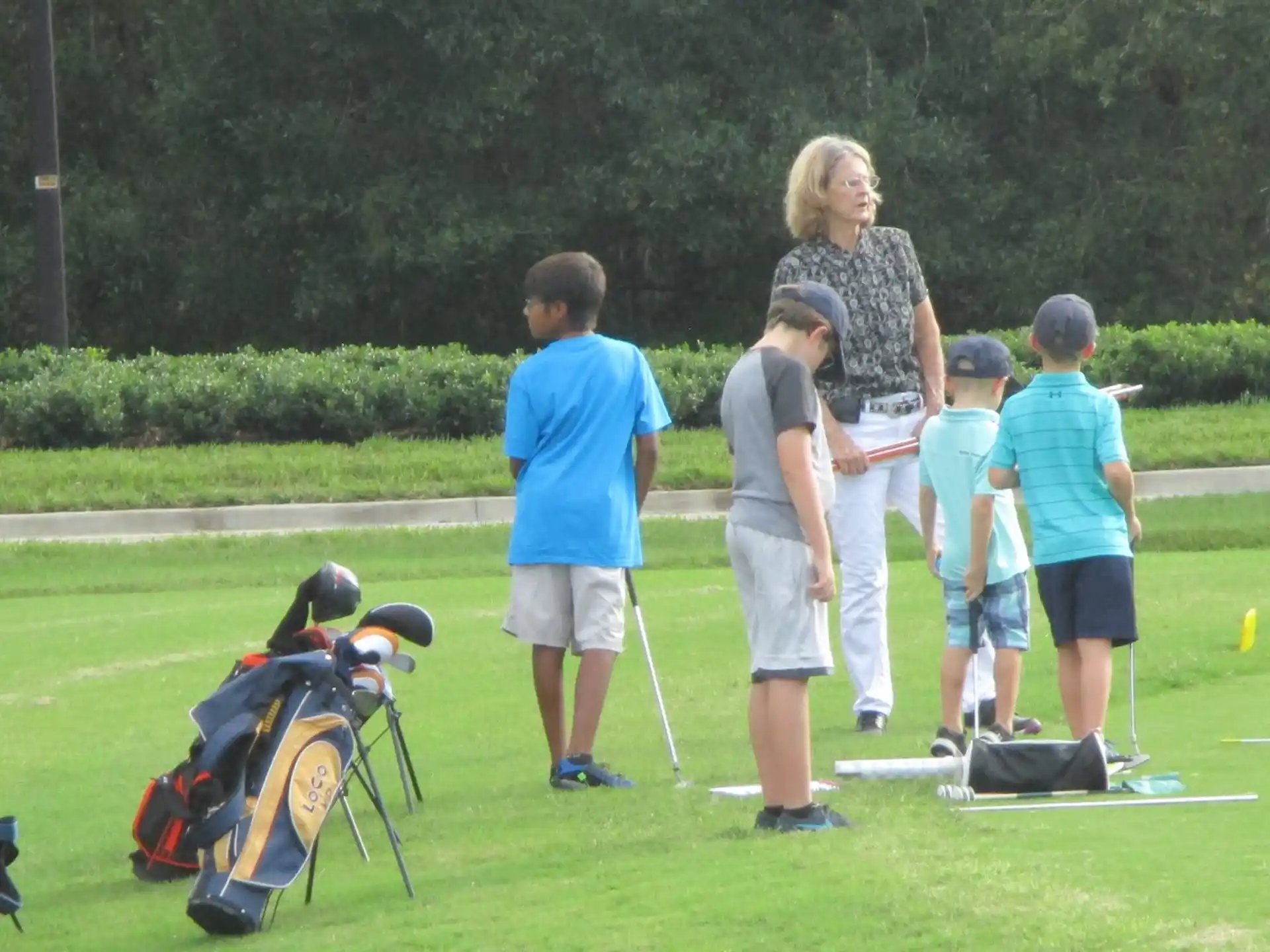 a group of people on a golf course