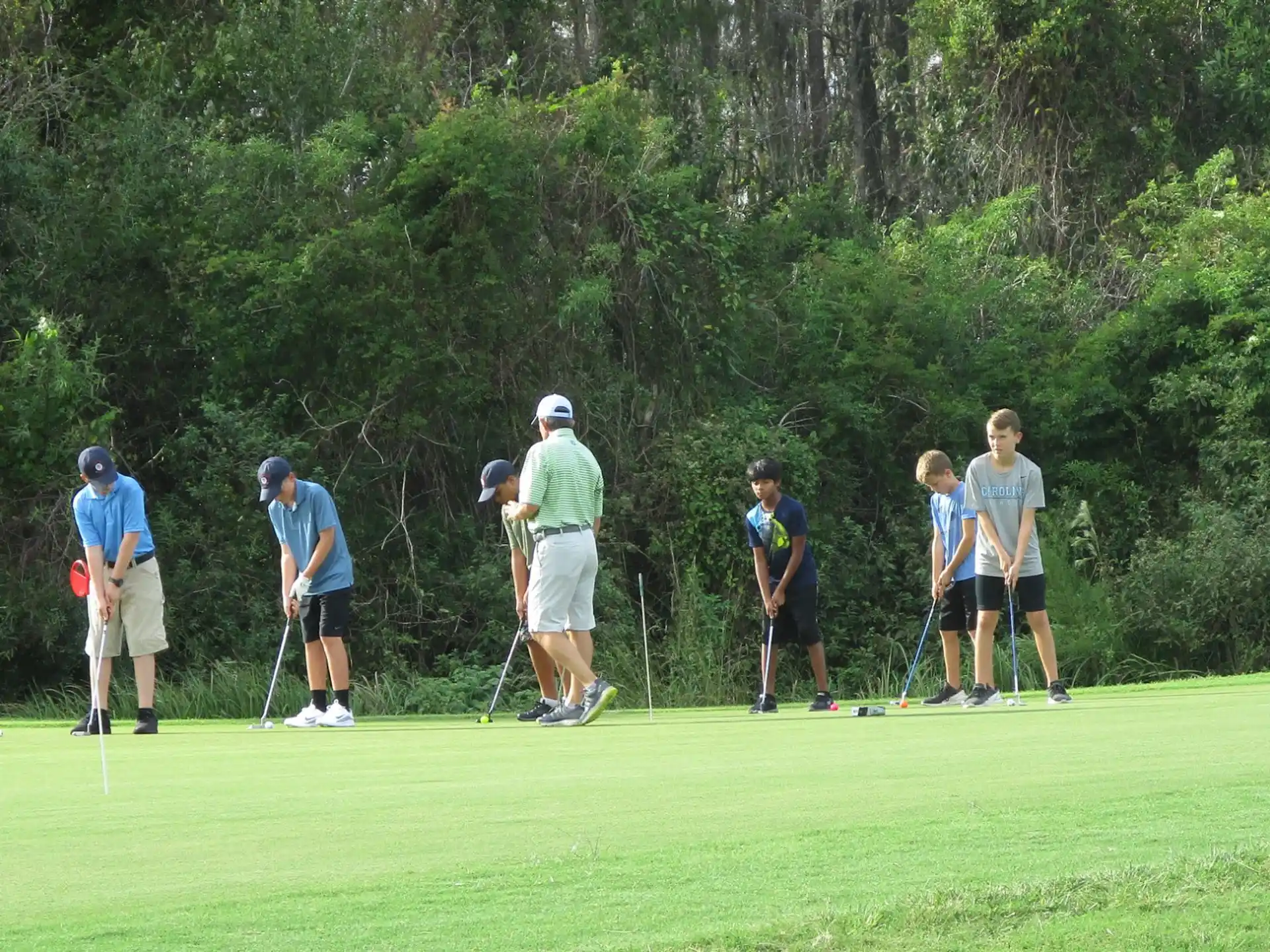 a group of people playing golf