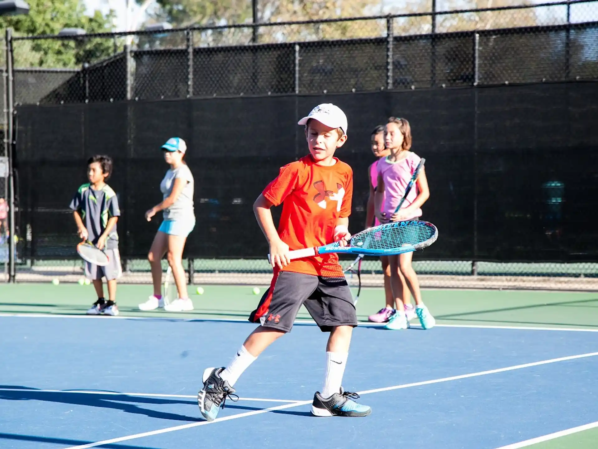 a boy playing tennis