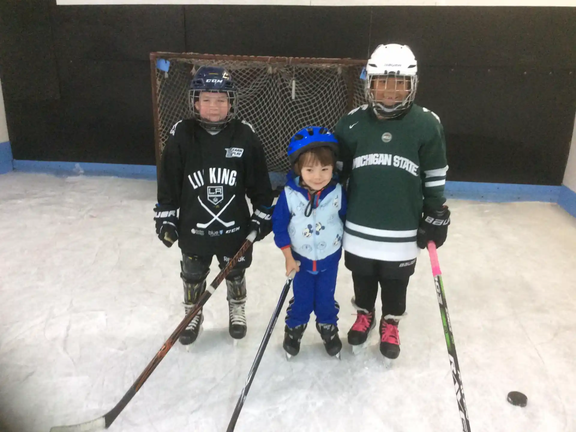 a group of kids wearing hockey gear