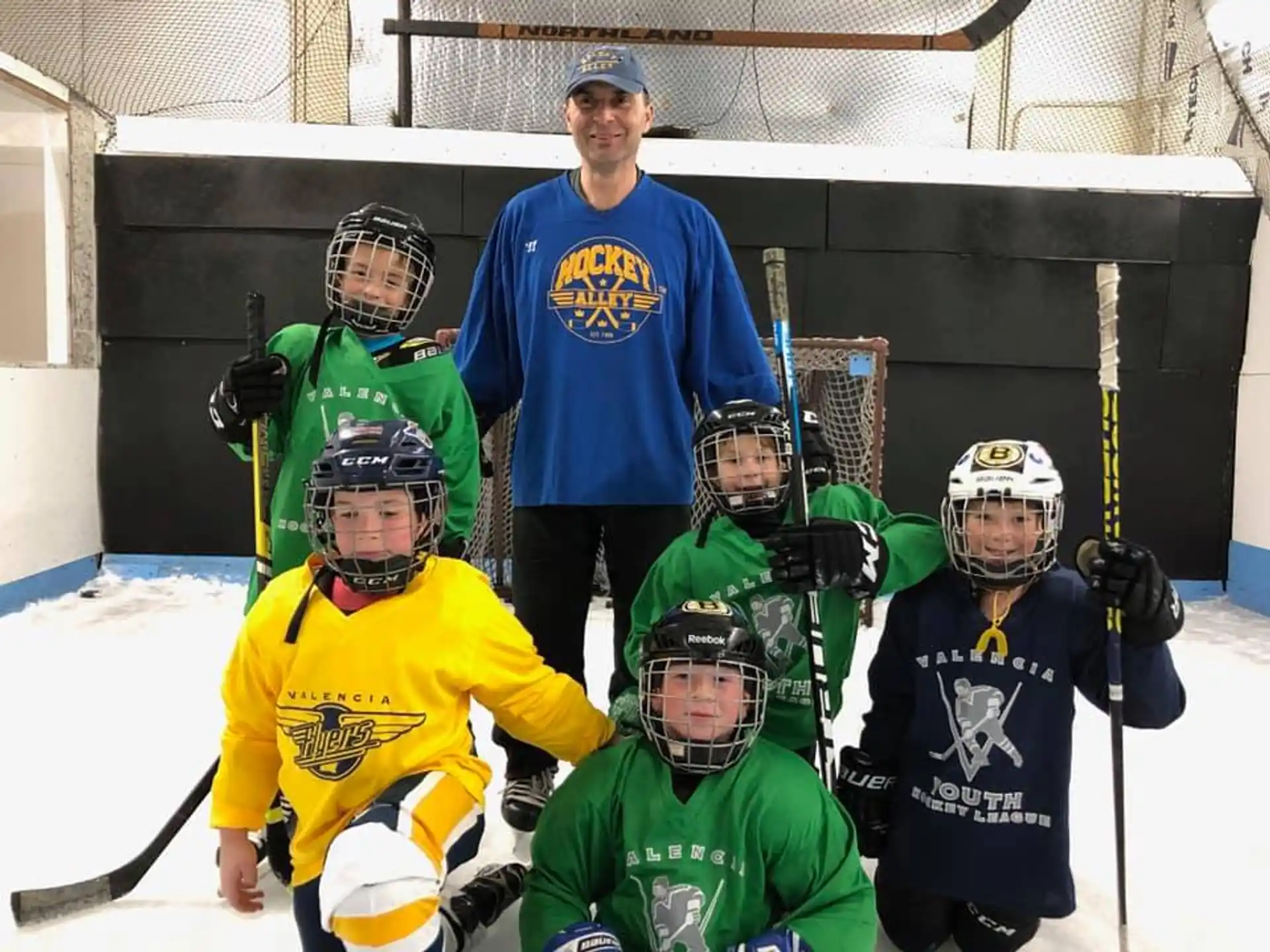 a group of people wearing hockey gear