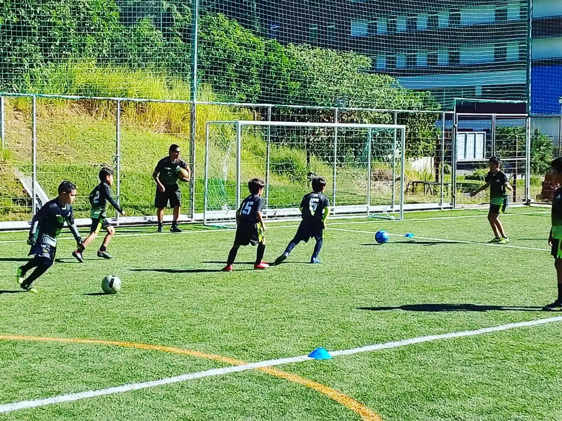a group of kids playing football
