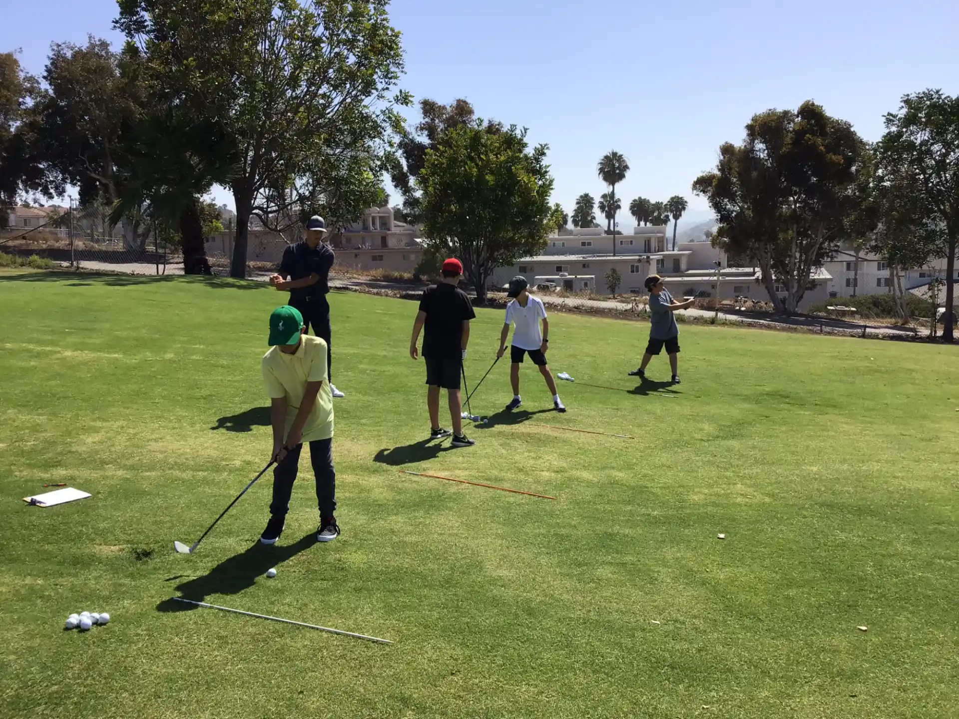a group of people playing golf