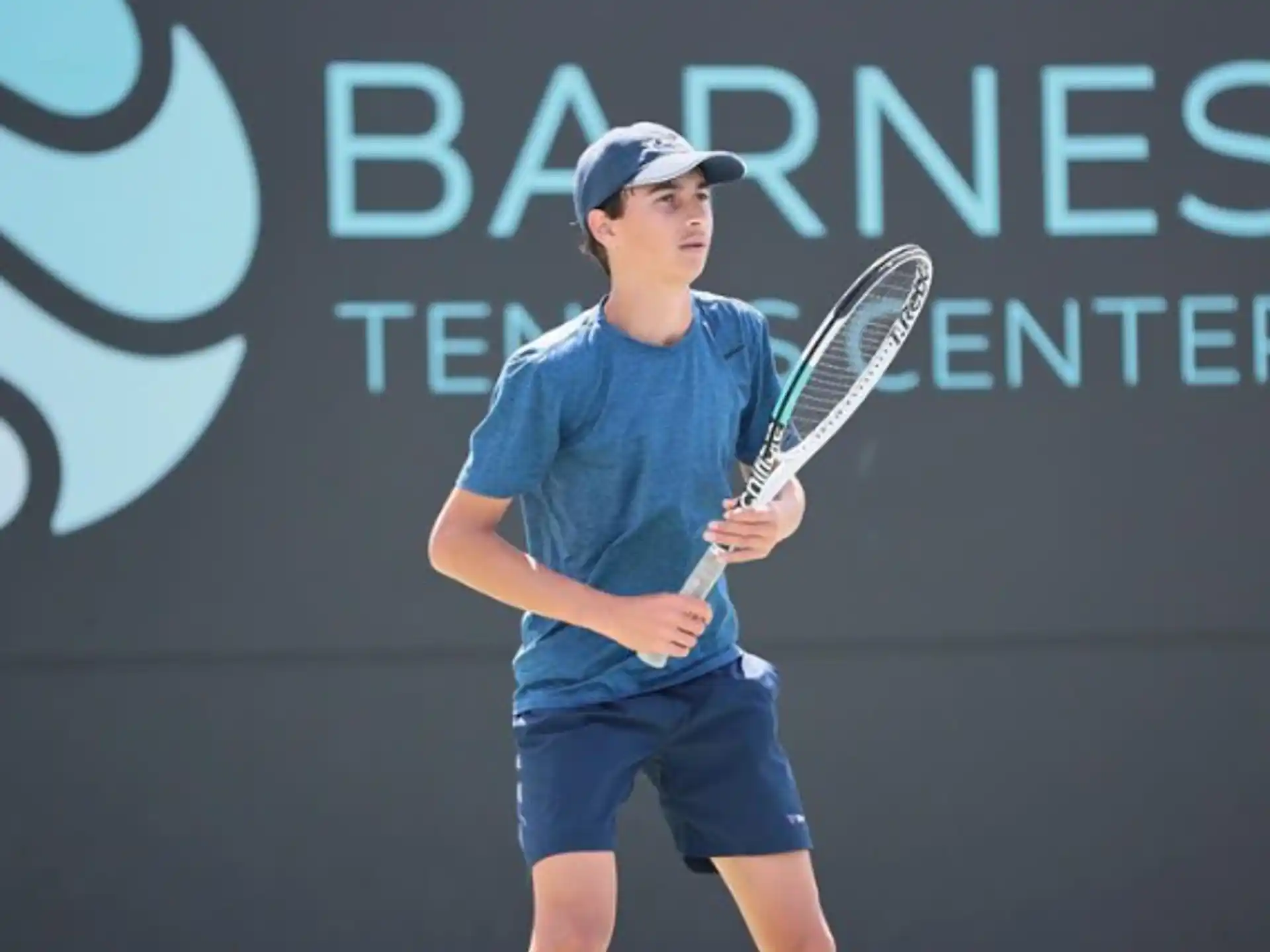 a person holding a tennis racket