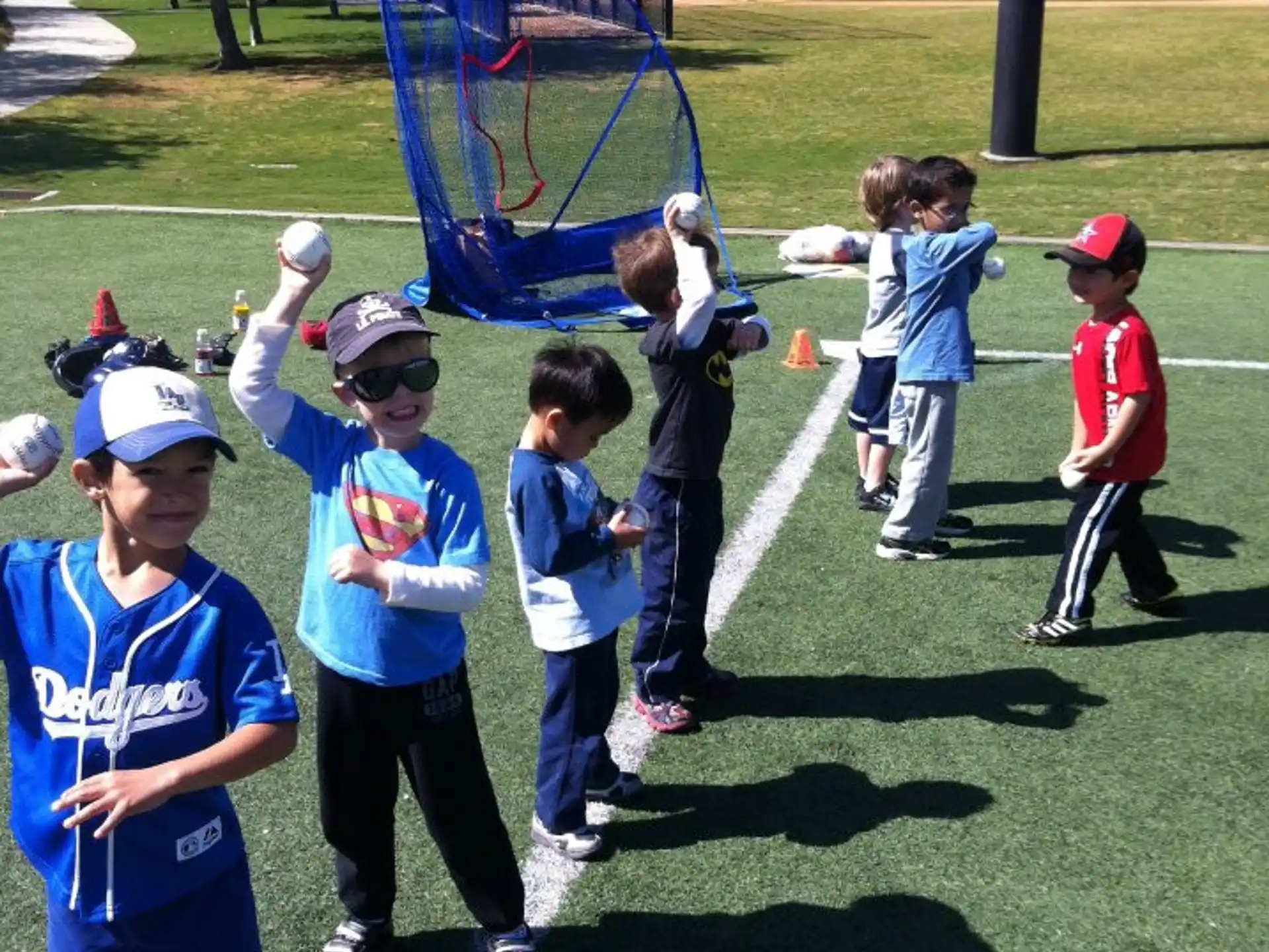 a group of kids playing baseball