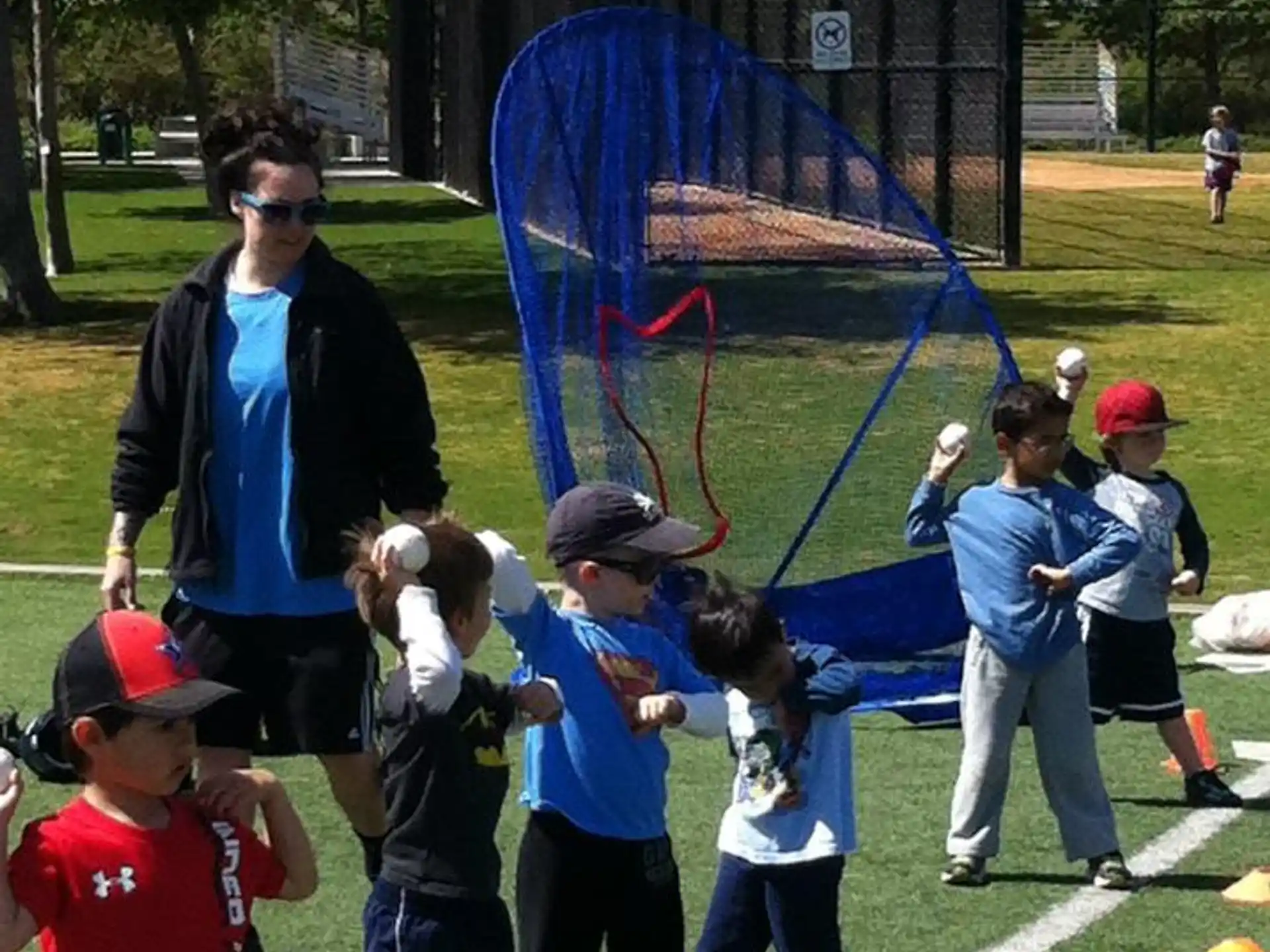 a group of kids playing with a net