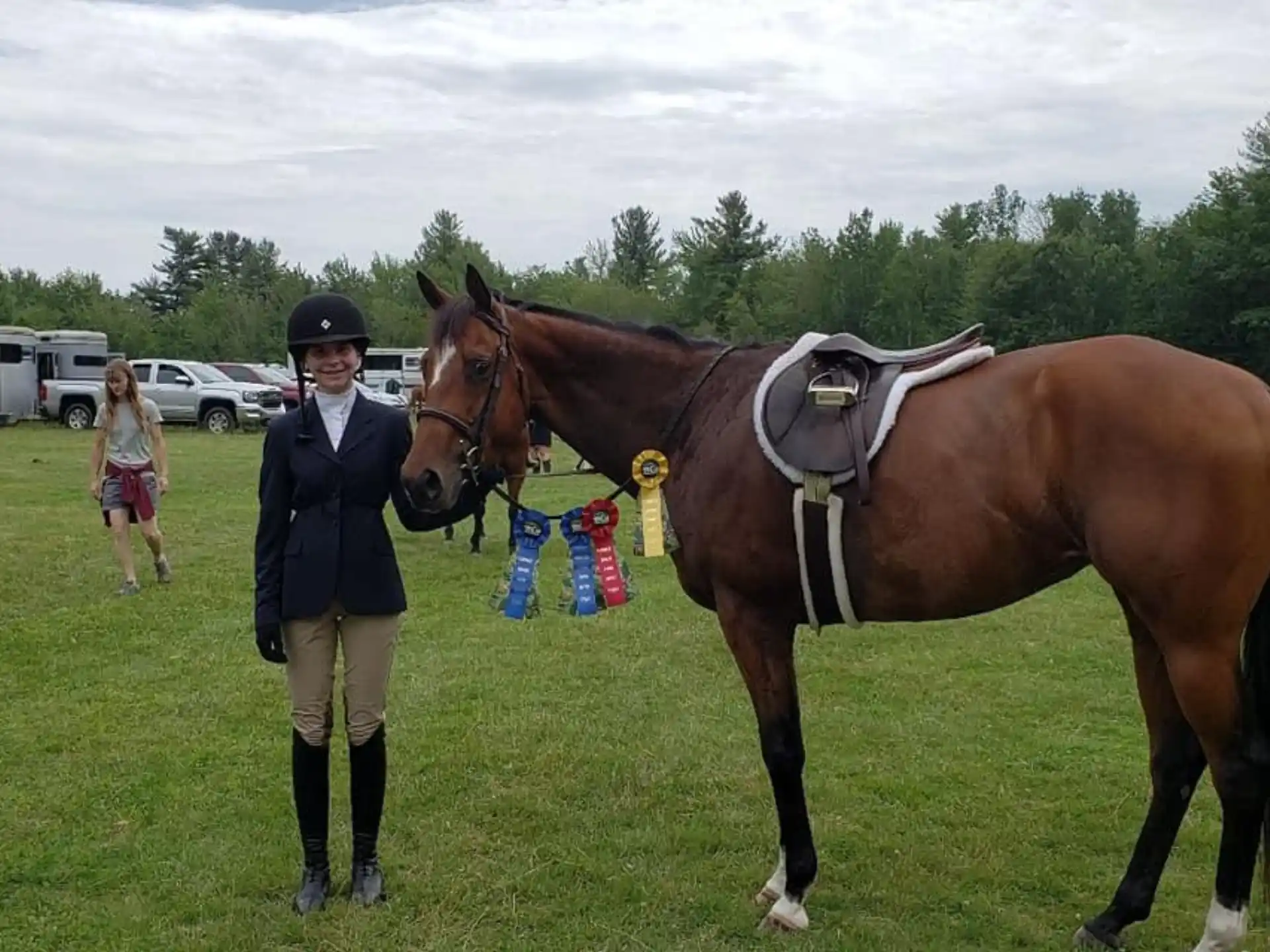 a person standing next to a horse