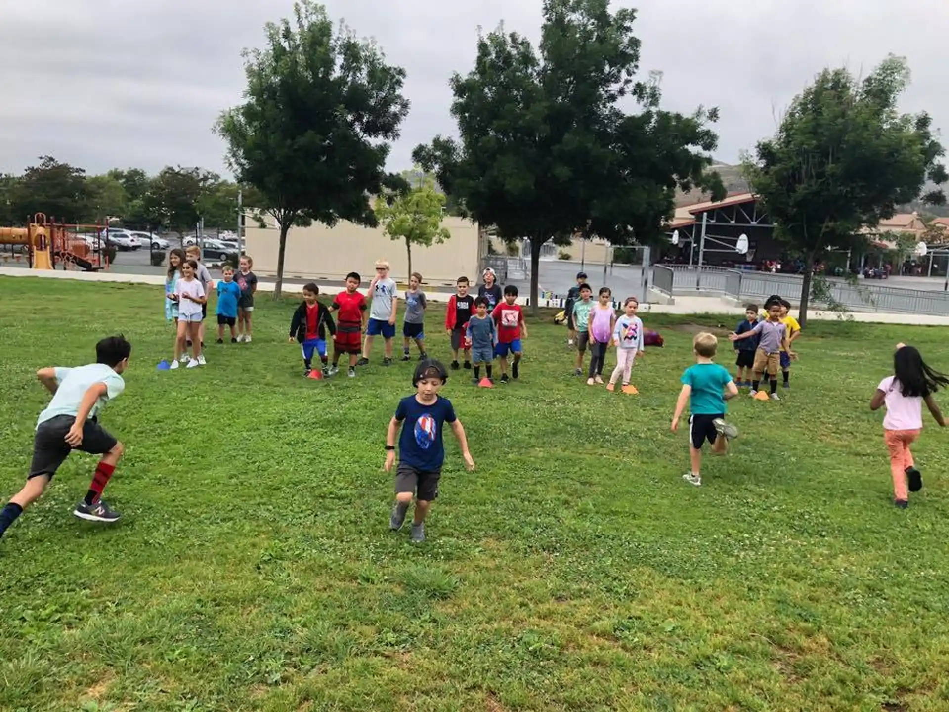 a group of kids playing in a field