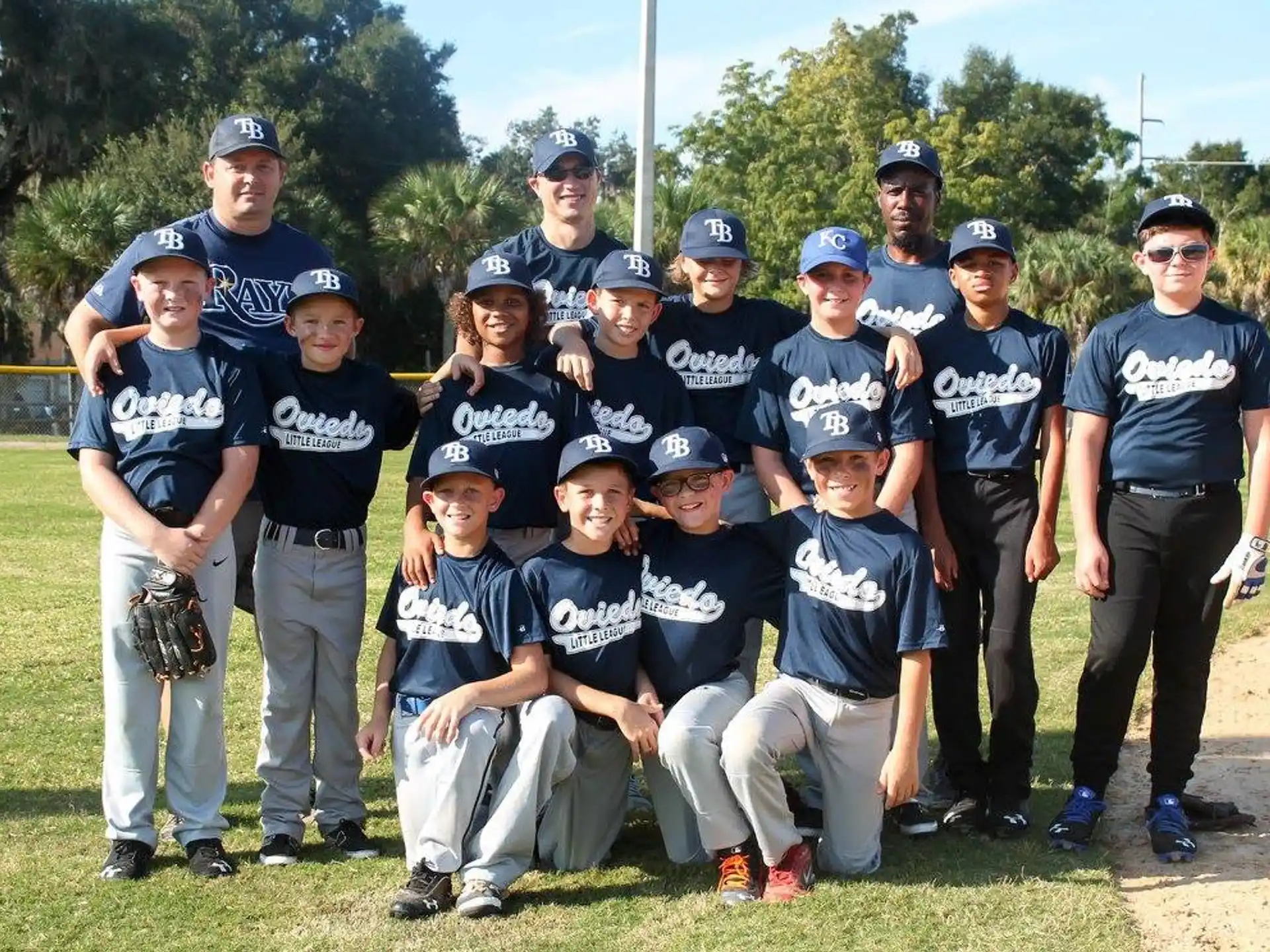 a group of baseball players posing for a photo