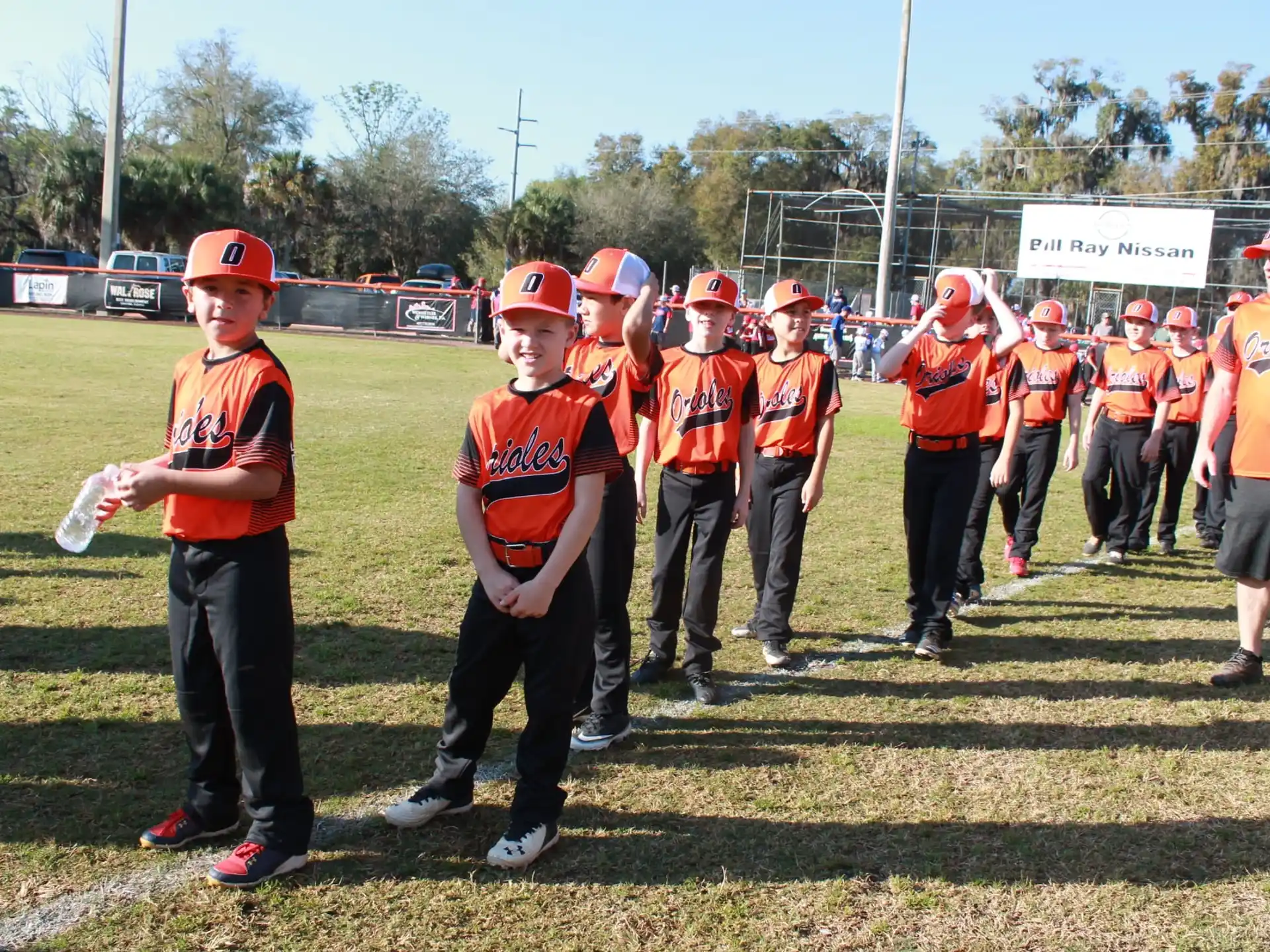 a group of people in orange uniforms