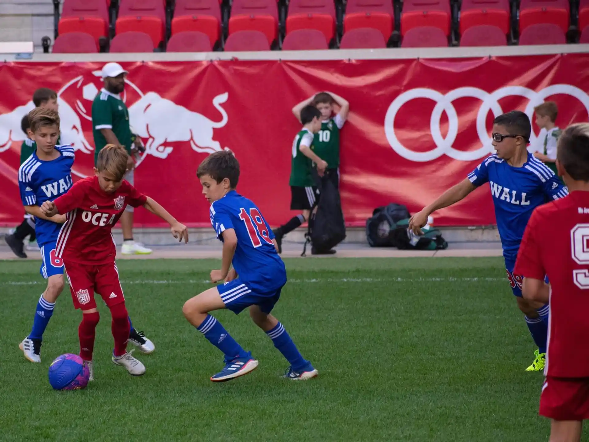 a group of kids playing football