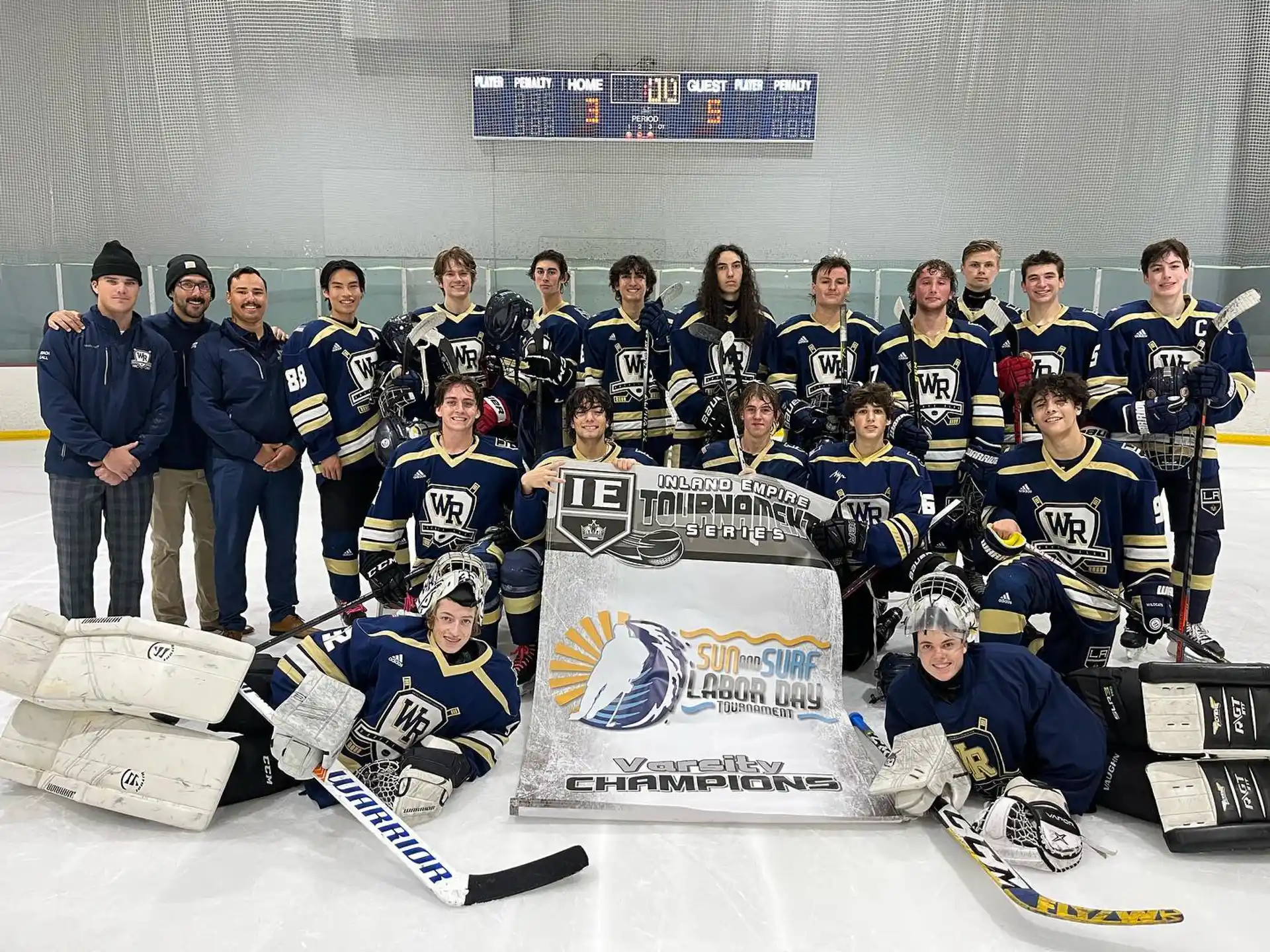 a group of hockey players posing for a photo