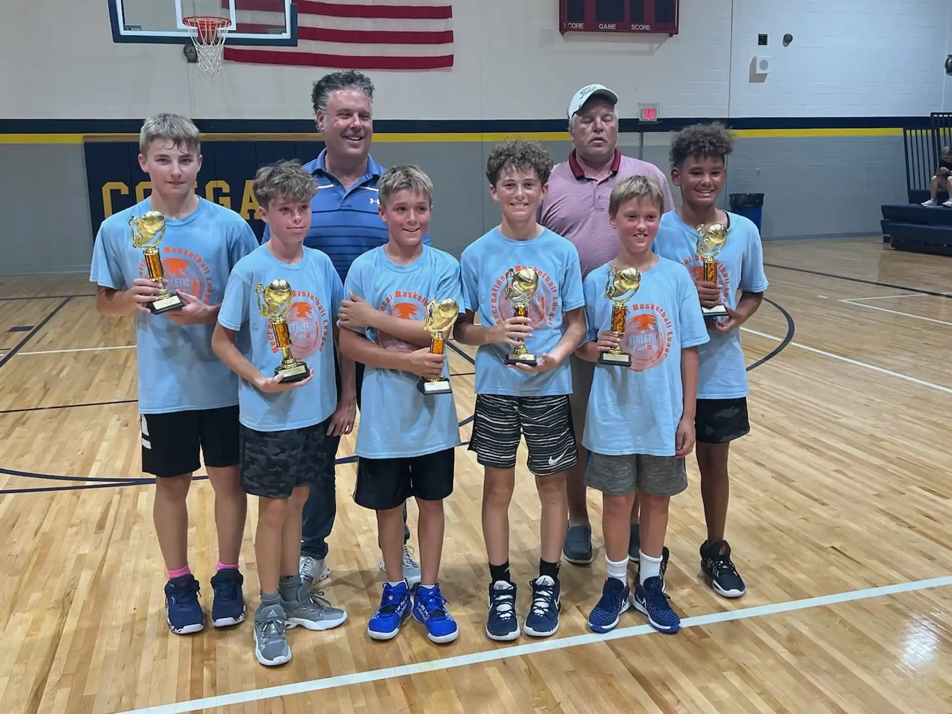a group of boys in athletic uniforms