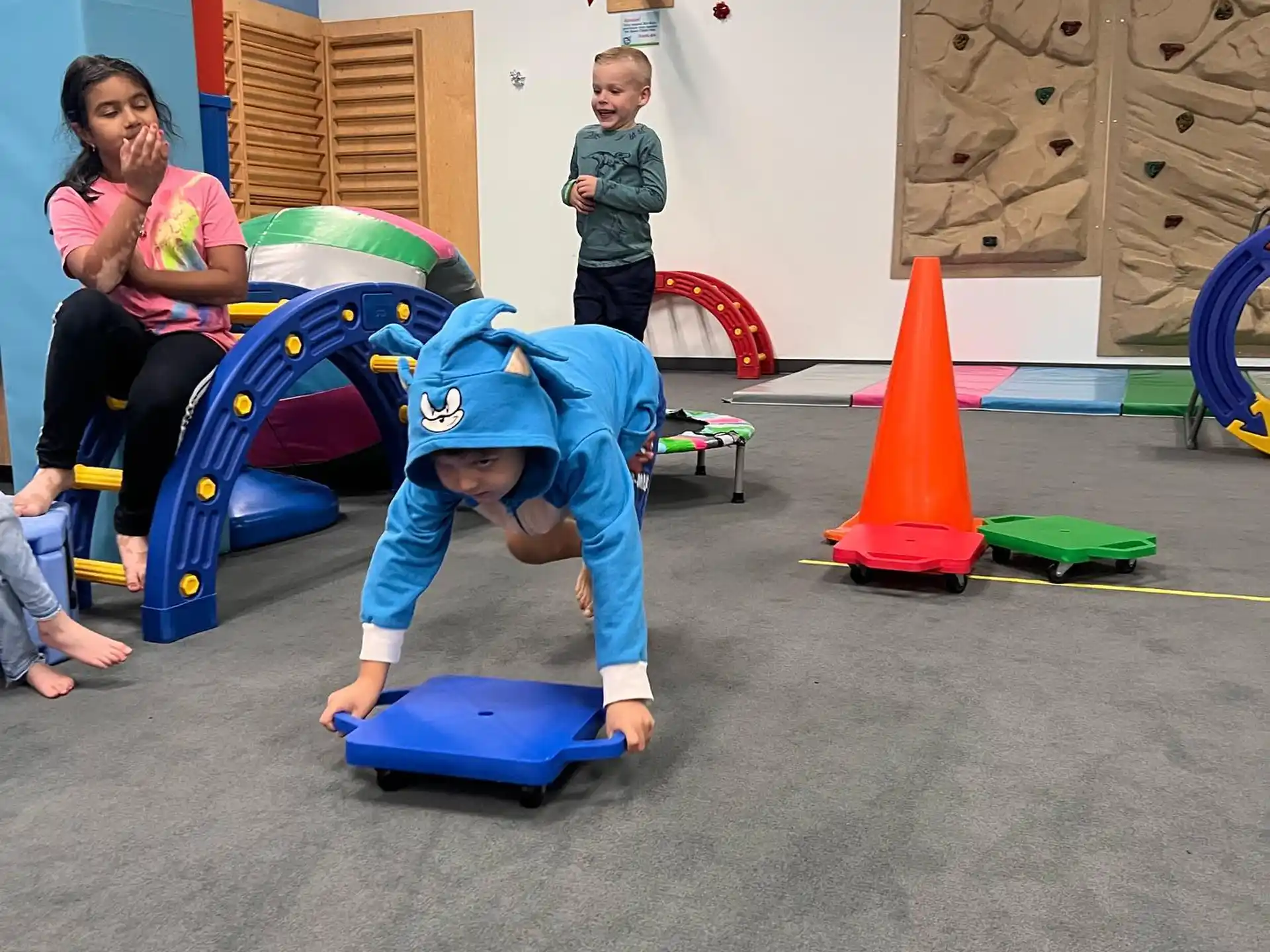 a boy in a blue garment