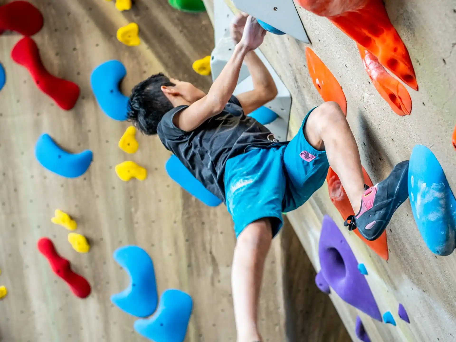 a person climbing a rock wall