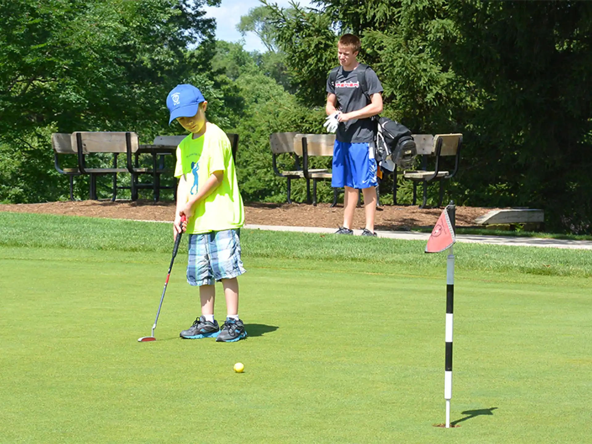 a boy playing golf