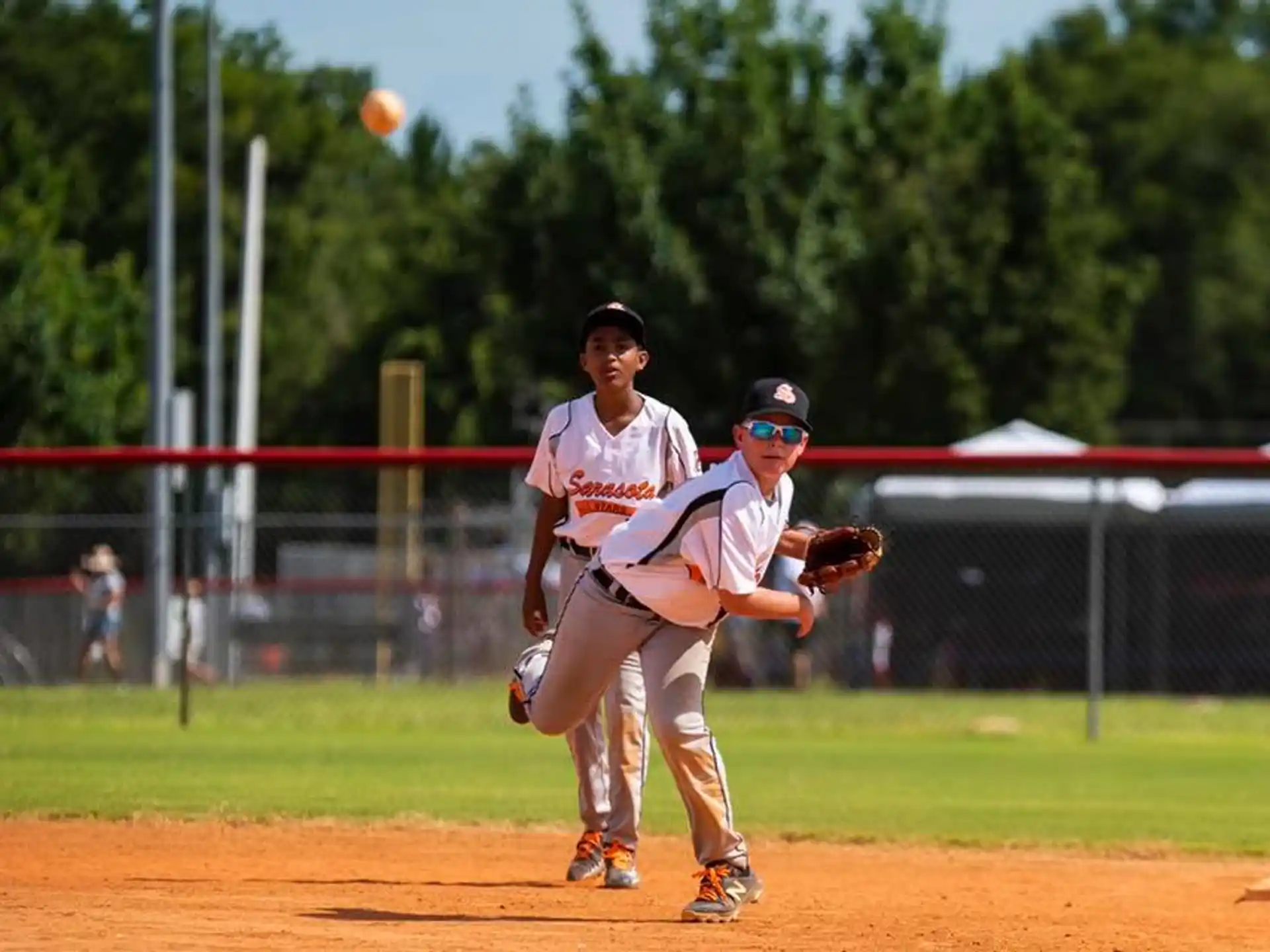 a couple of baseball players playing baseball