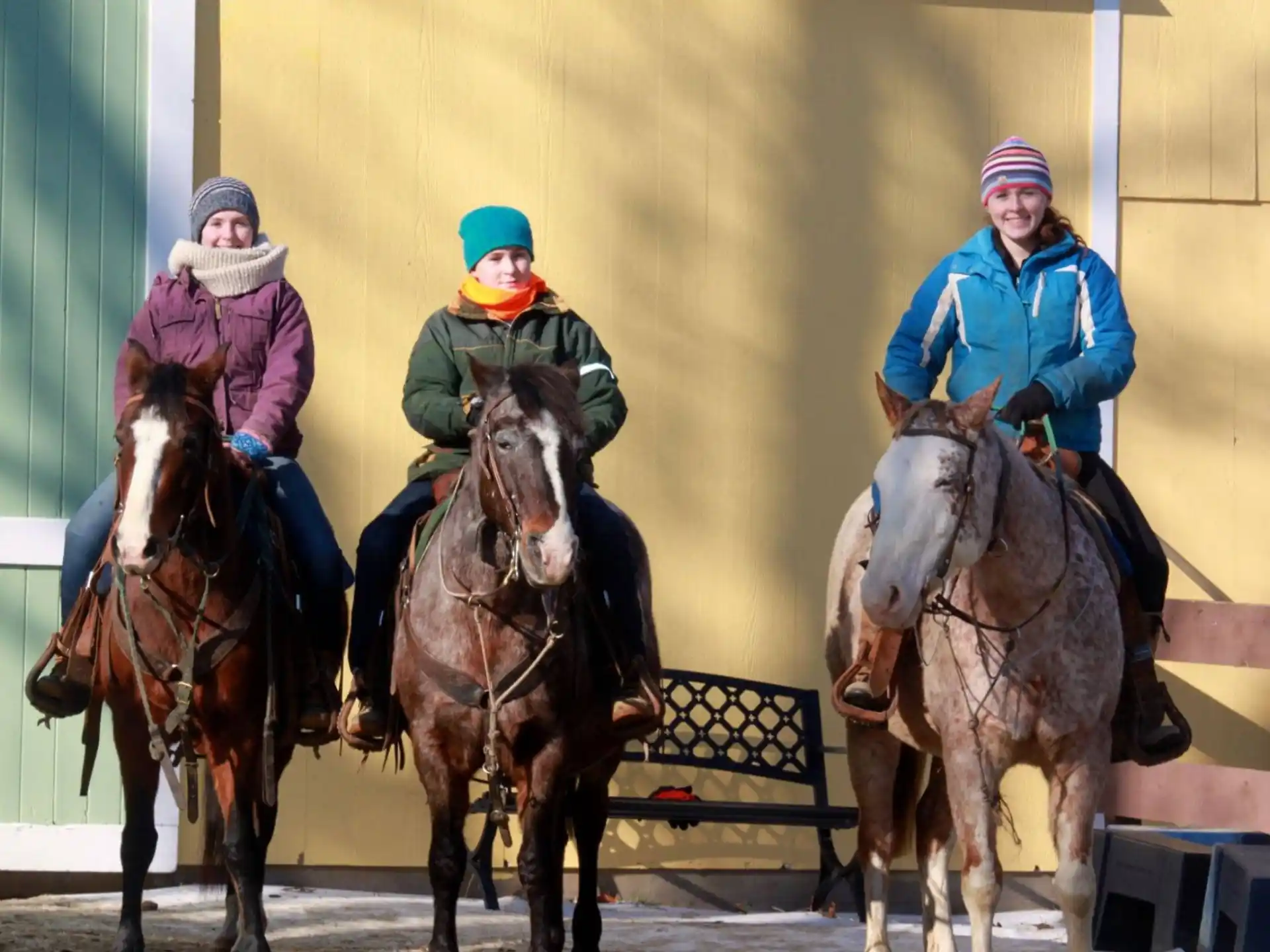 a group of people riding horses