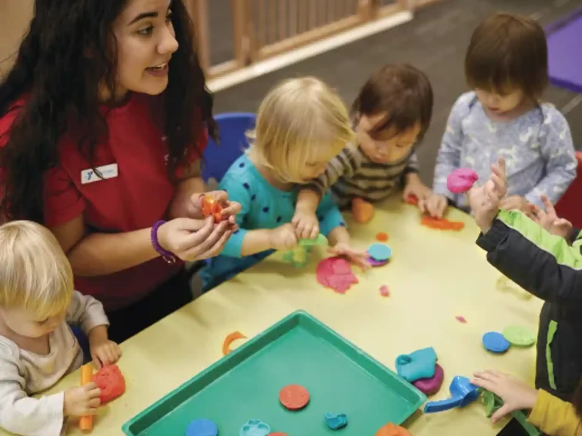 a person and several children playing a game