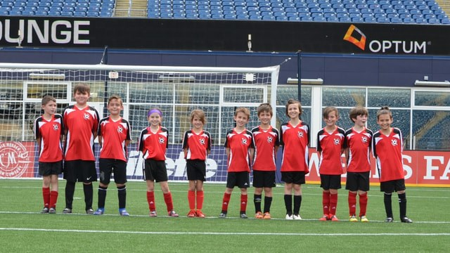 a group of football players posing for a photo