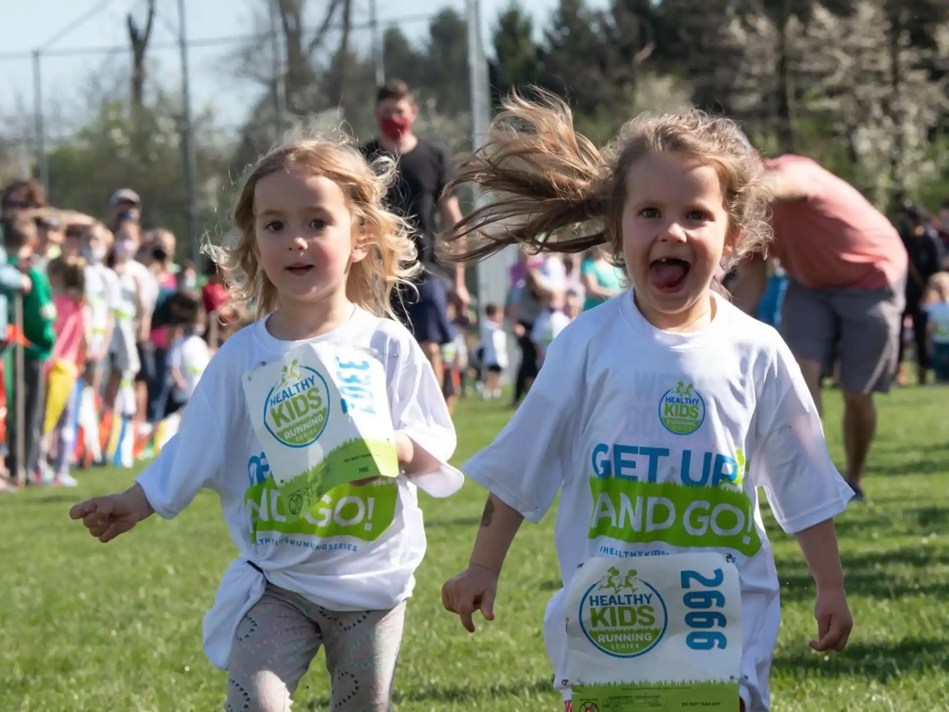 a couple of children running in a race
