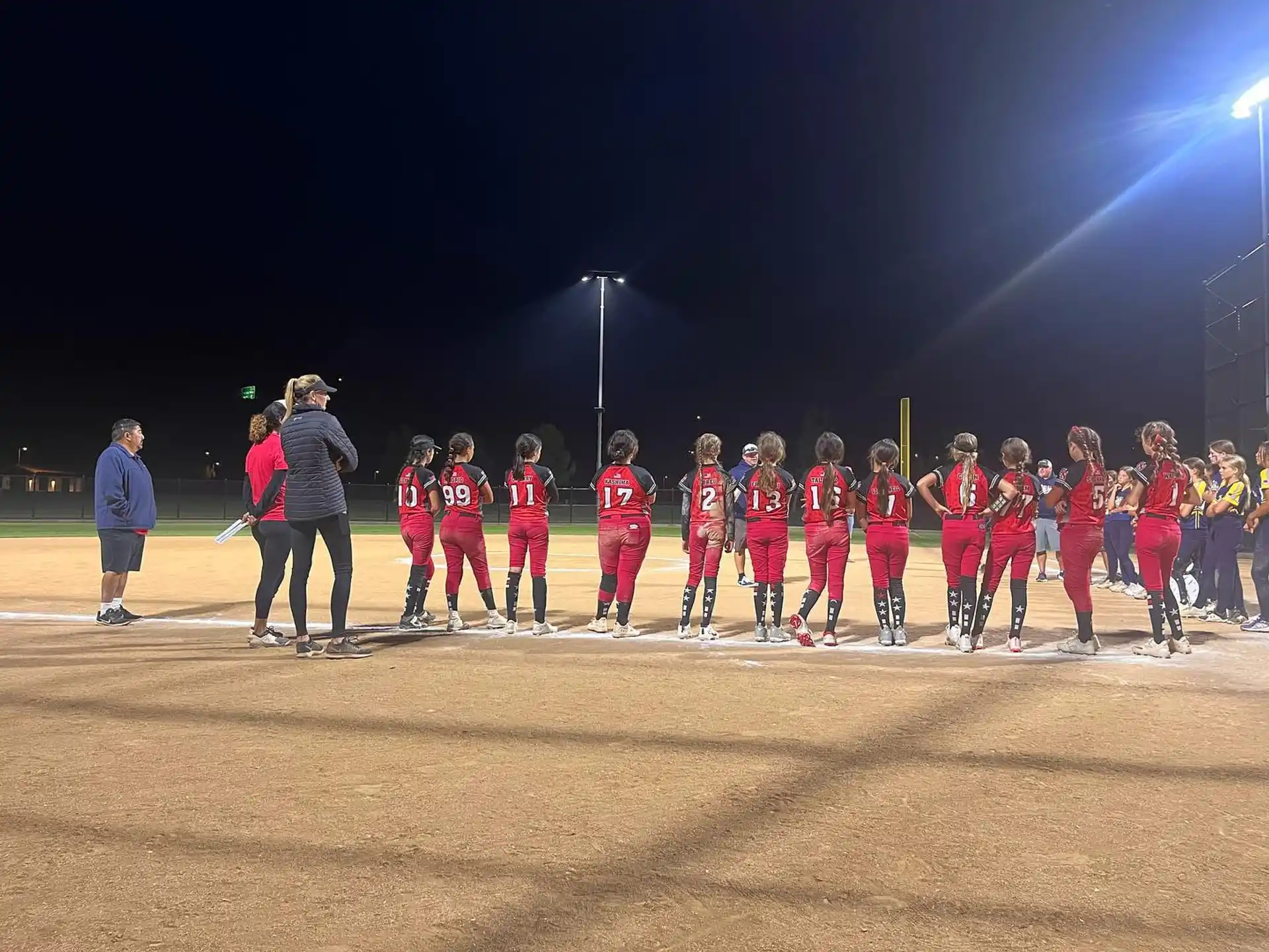 a group of people in red uniforms
