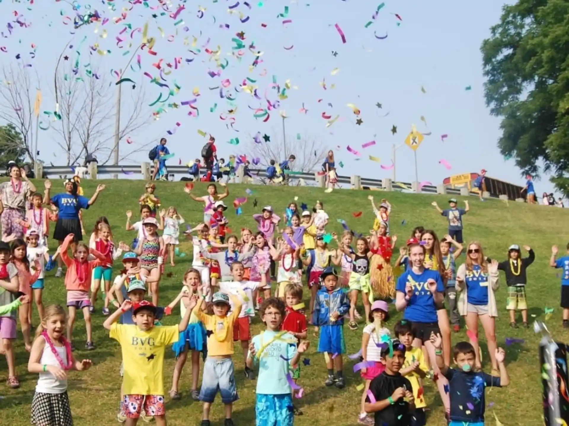 a group of people flying kites